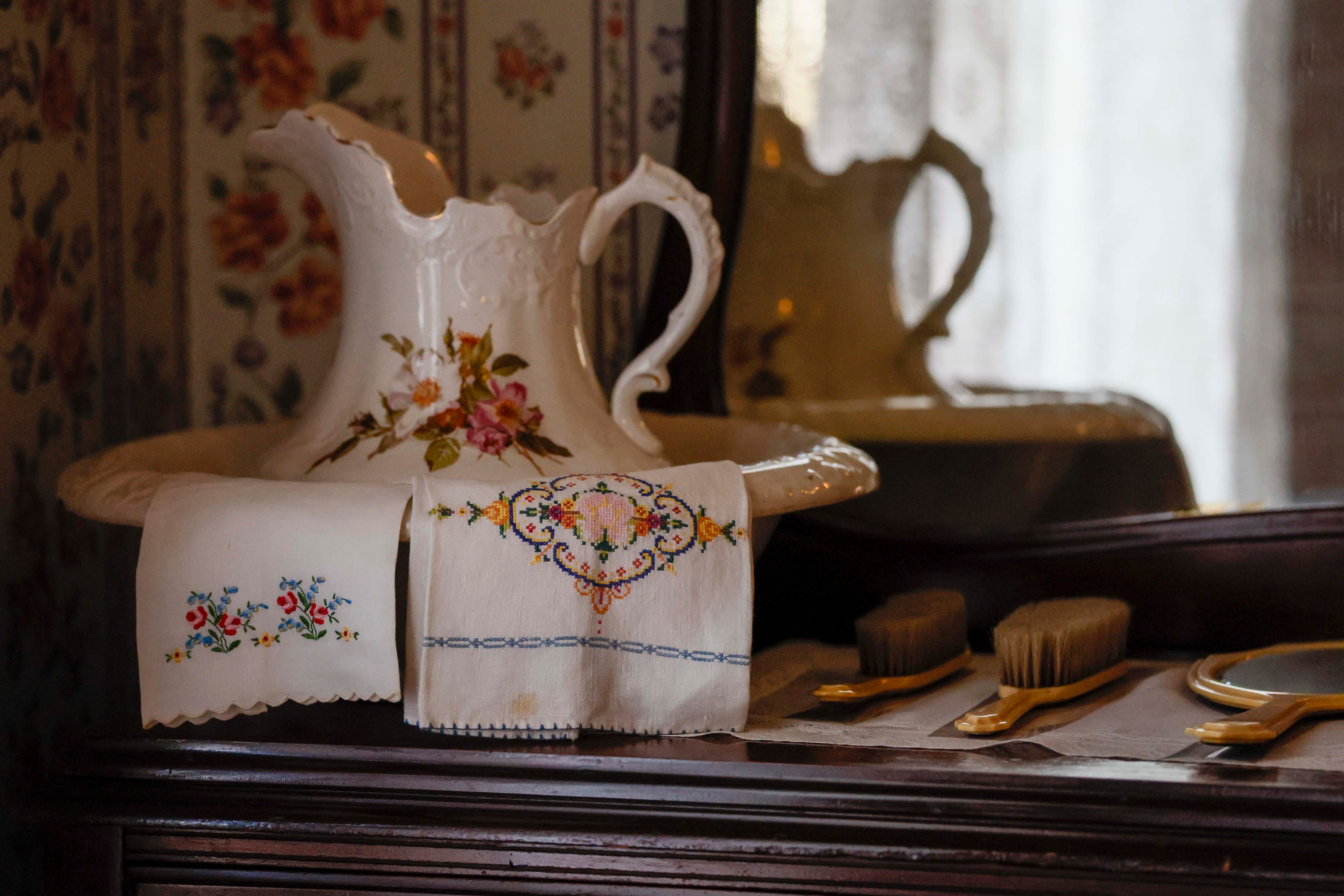 A wash basin and pitcher on a dresser in the guest room of the guest room of Martin Luther King Jr.'s childhood home on Thursday, July 2, 2026. (Miguel Martinez/AJC)