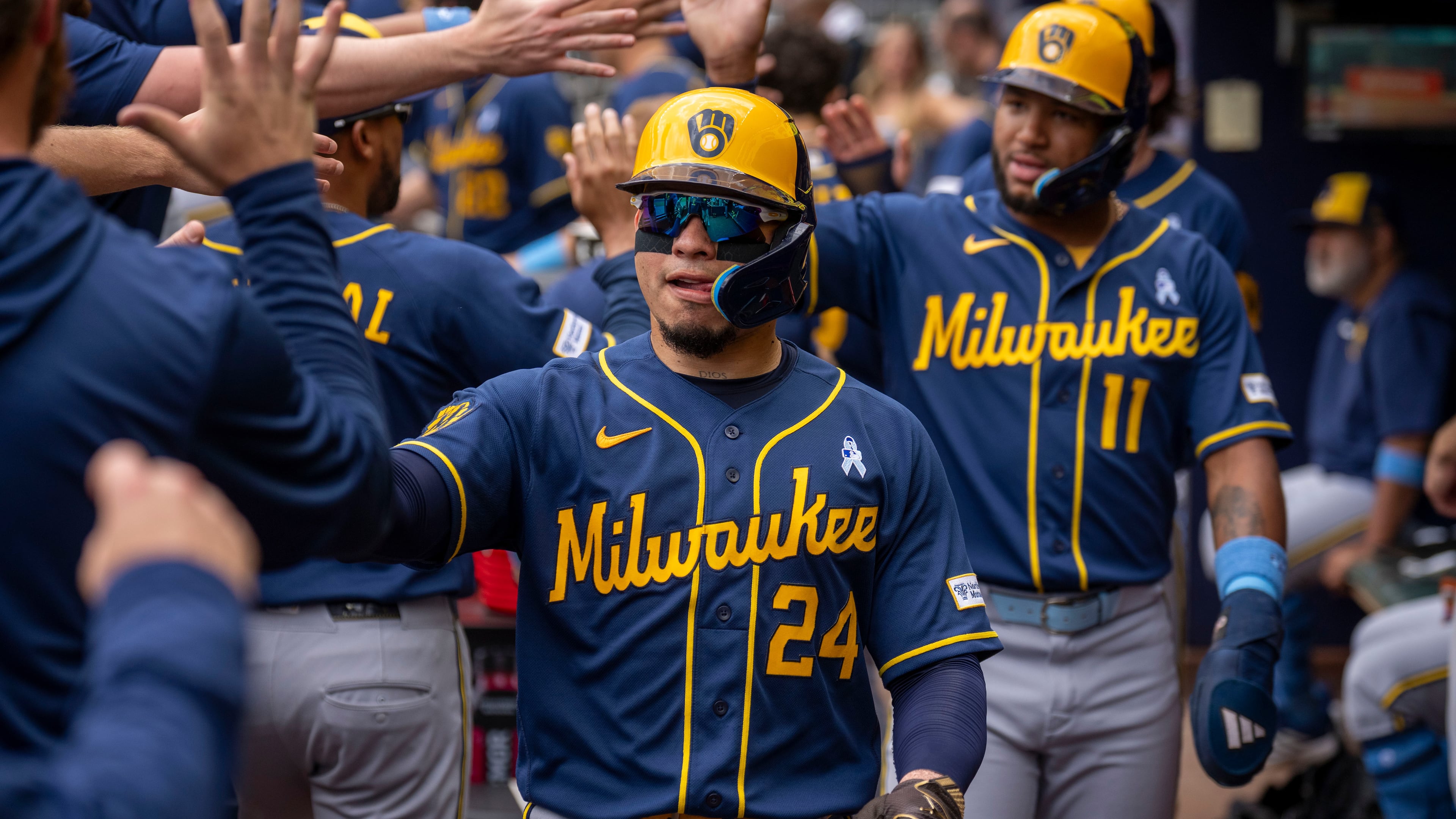 Milwaukee Brewers' William Contreras (24) celebrates after batting in three runs during the second inning of a baseball game against the Atlanta Braves, Sunday, June 21, 2026, in Atlanta. (AP Photo/Erik Rank)
