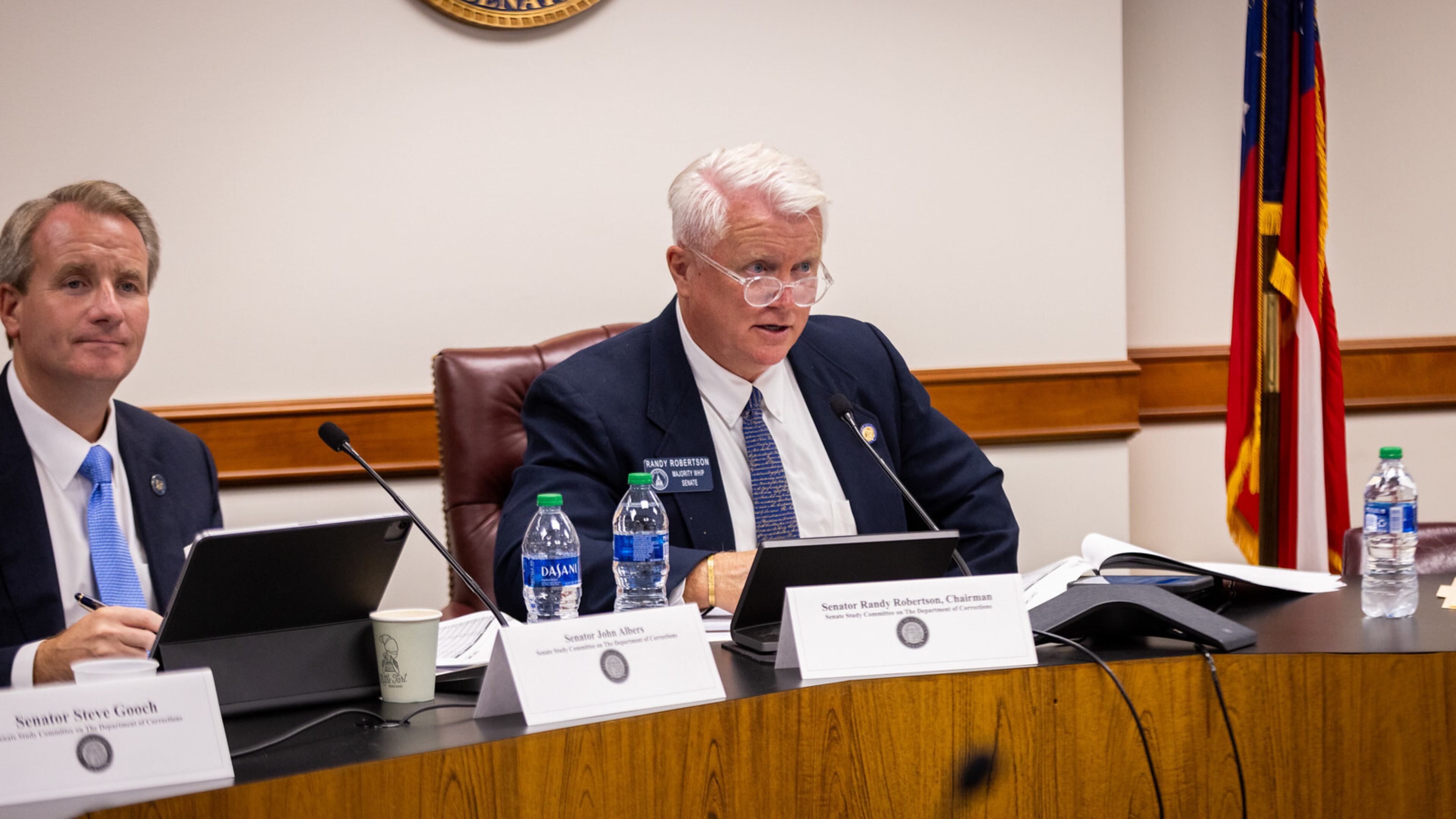 State Sen. Randy Robertson, R-Cataula, chairman of the Department of Corrections Facilities Study Committee, and Sen. John Albers, R-Roswell, listen to testimony at a committee meeting in August.
