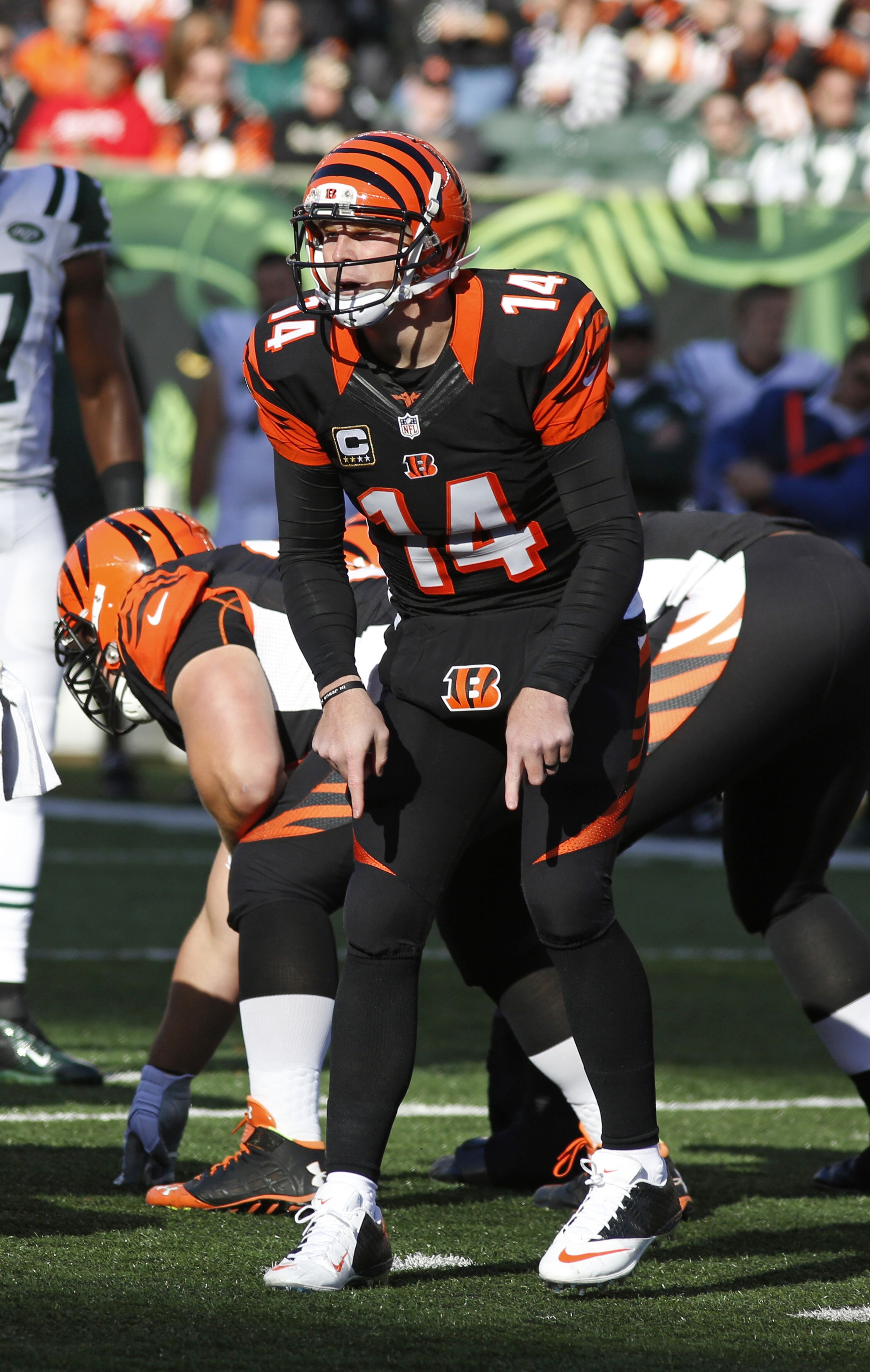 Cincinnati Bengals quarterback Andy Dalton calls a play during an NFL football game against the New York Jets in Cincinnati. The Cincinnati Bengals beat the New York Jets 49-9. (AP Photo/David Kohl)