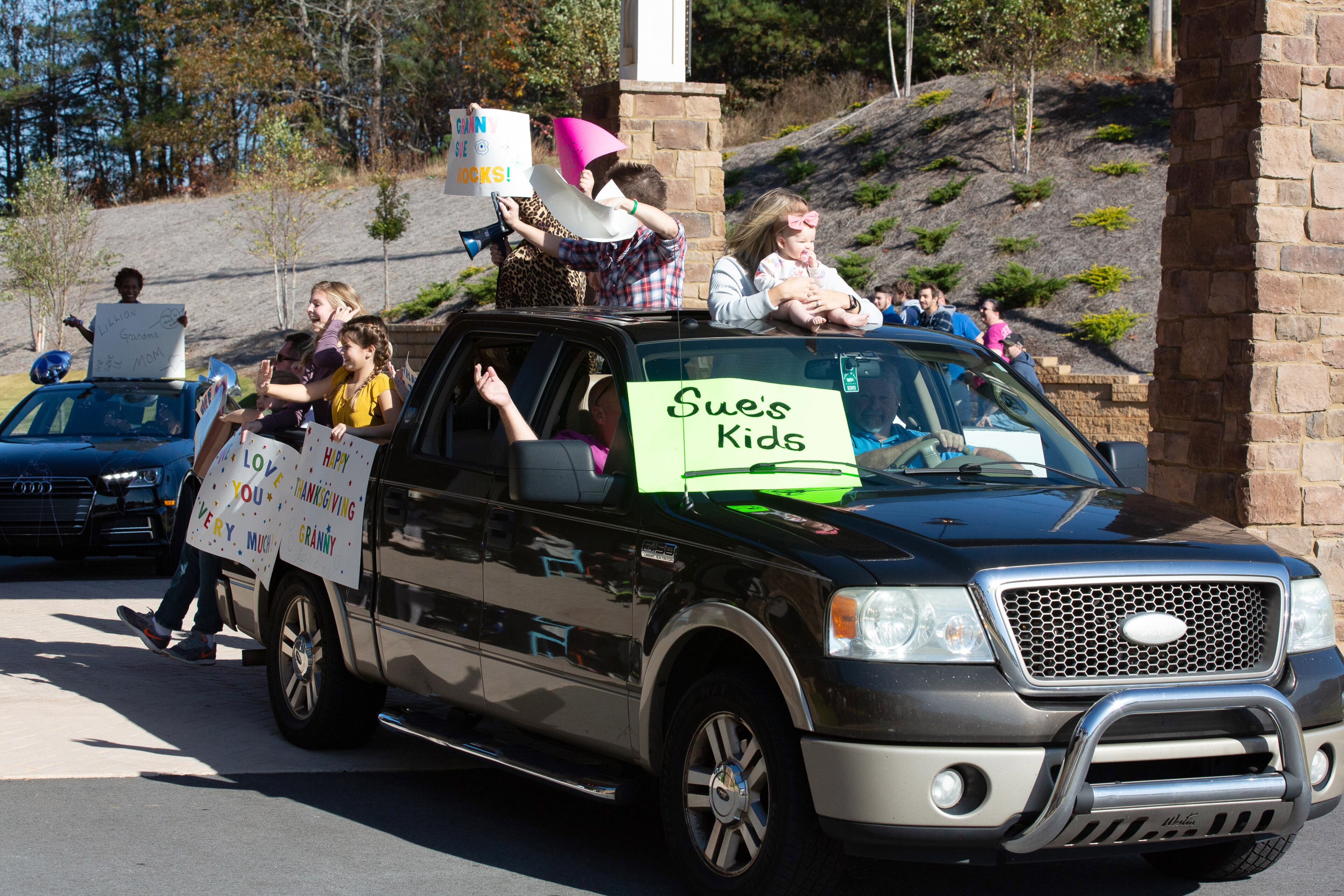 People ride by in their decorated vehicles as residents watch for friends and family at the assisted living home Oaks at Douglasville during the Thanksgiving Day outdoor parade on Thursday, November 26, 2020. (Photo: Steve Schaefer for The Atlanta Journal-Constitution)