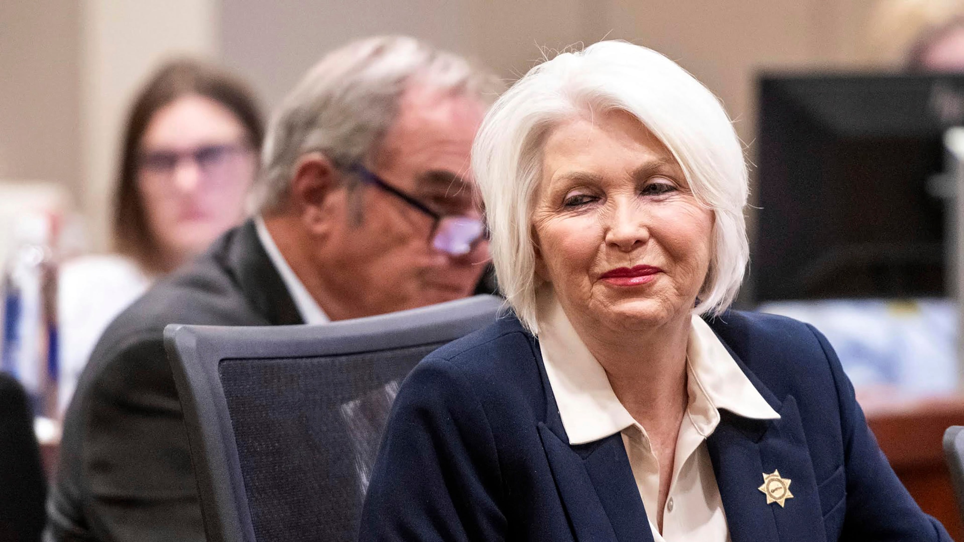 FILE - Former Mesa County Clerk and Recorder Tina Peters smiles at supporters sitting behind her during her sentencing for her election interference case at the Mesa County District Court, Thursday, Oct. 3, 2024, in Grand Junction, Colo. (Larry Robinson/The Grand Junction Daily Sentinel via AP, File)