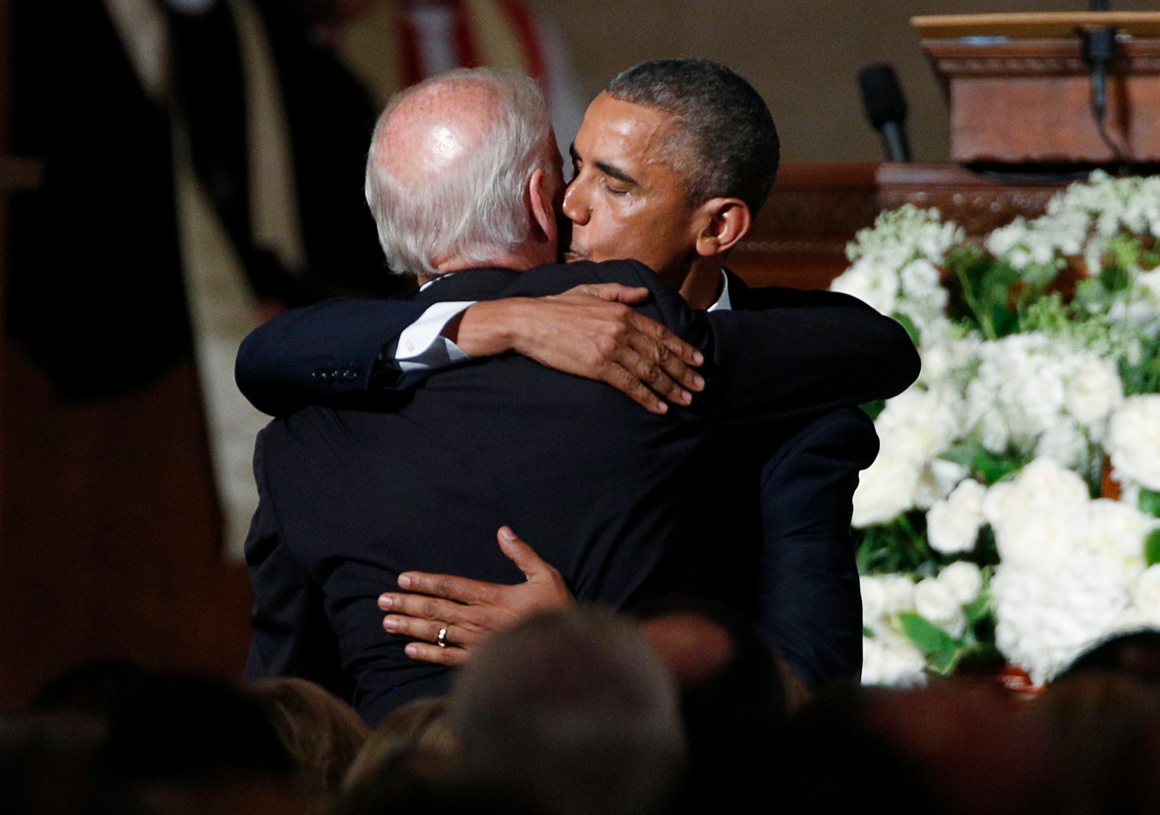 President Barack Obama kisses Vice President Joe Biden after delivering the eulogy during funeral services for Biden's son, Beau, Saturday, June 6, 2015, at St. Anthony of Padua Church in Wilmington, Del. (Kevin Lamarque/Pool Photo via AP)