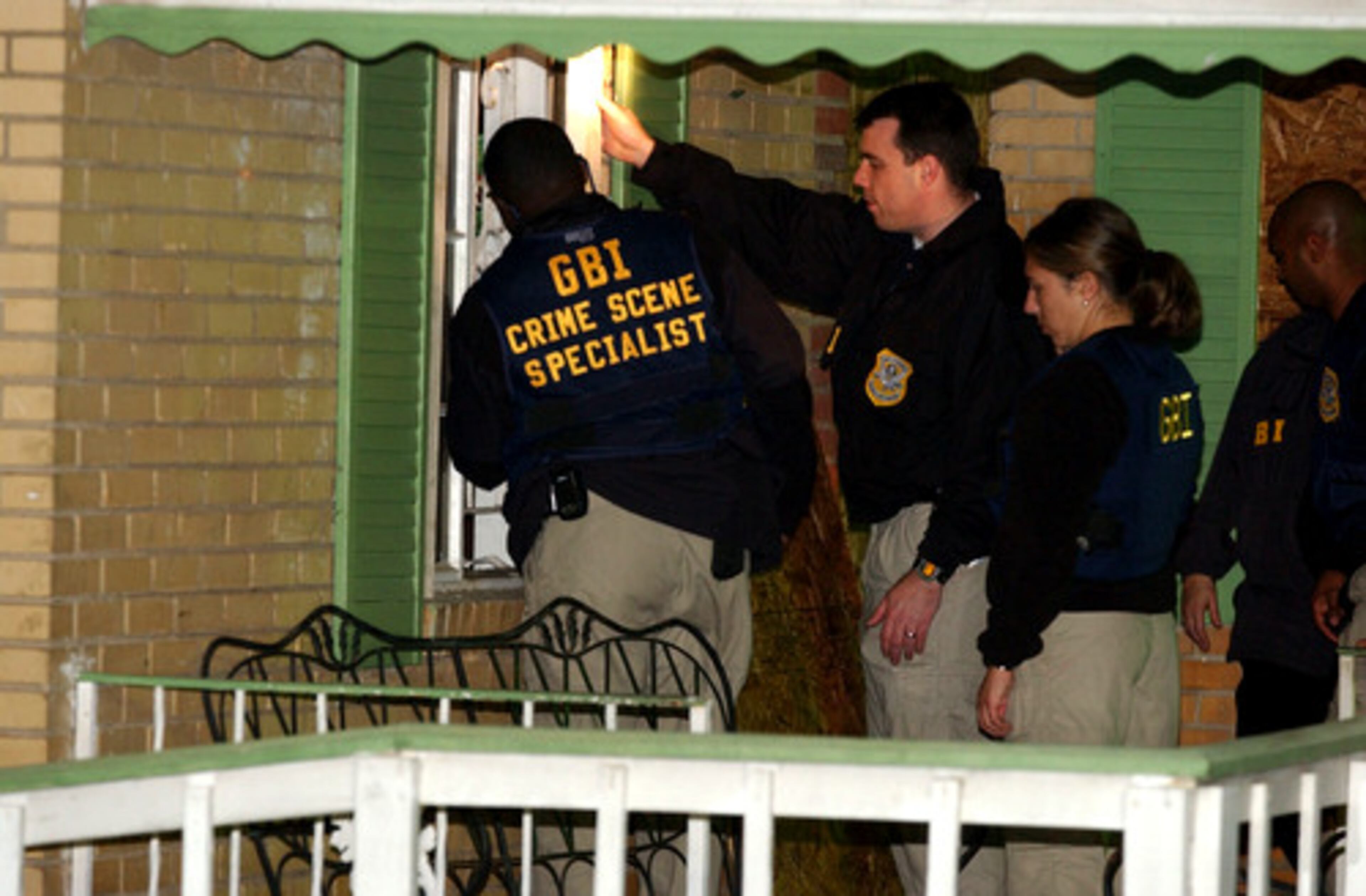 On Nov. 28, 2006, GBI agents investigate the scene of the shootout.