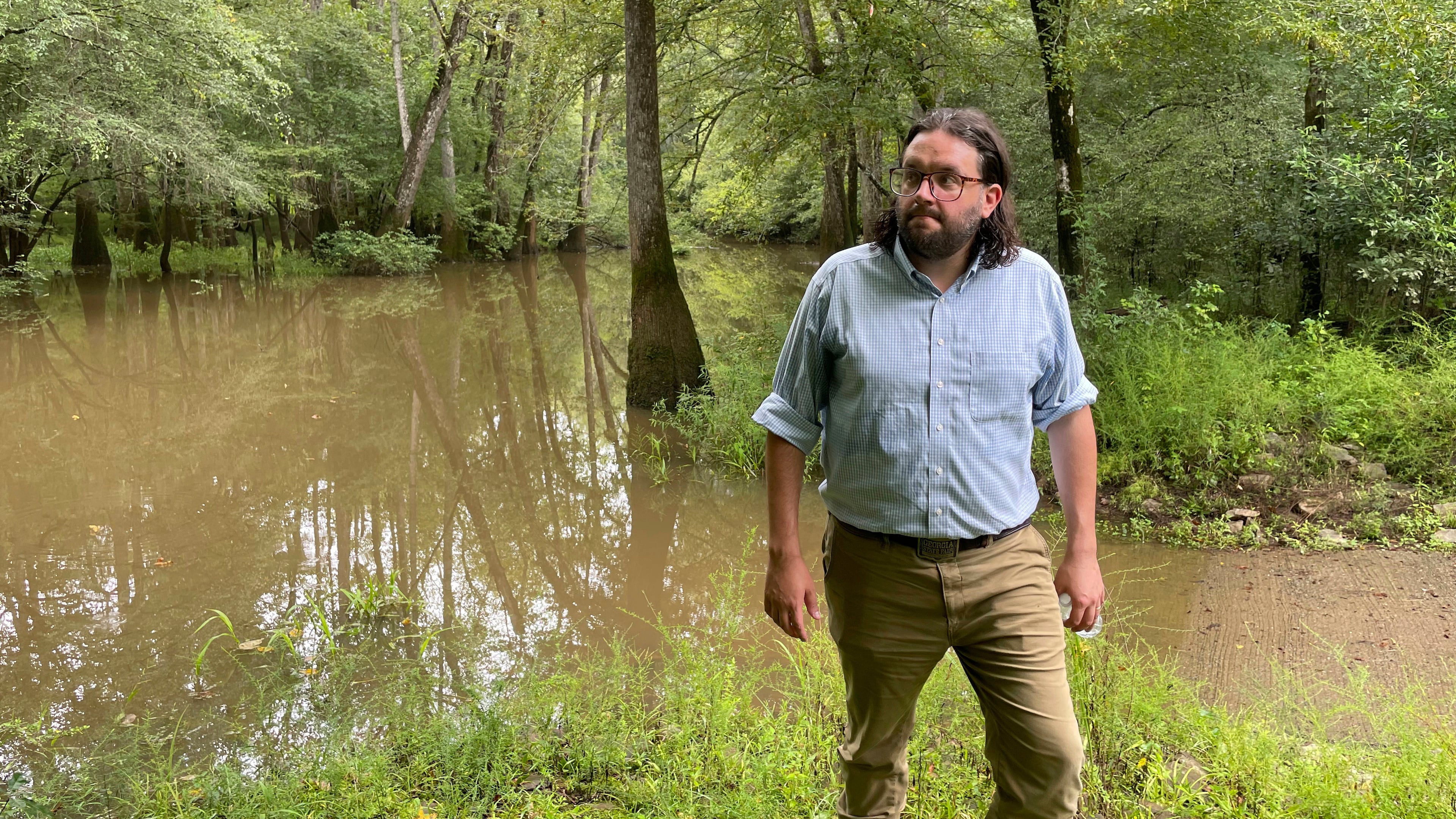 FILE - Seth Clark, then mayor pro-tem of Macon, walks in the Bond Swamp National Wildlife Refuge in Round Oak, Ga., on Aug. 22, 2022. (AP Photo/Michael Warren, File)
