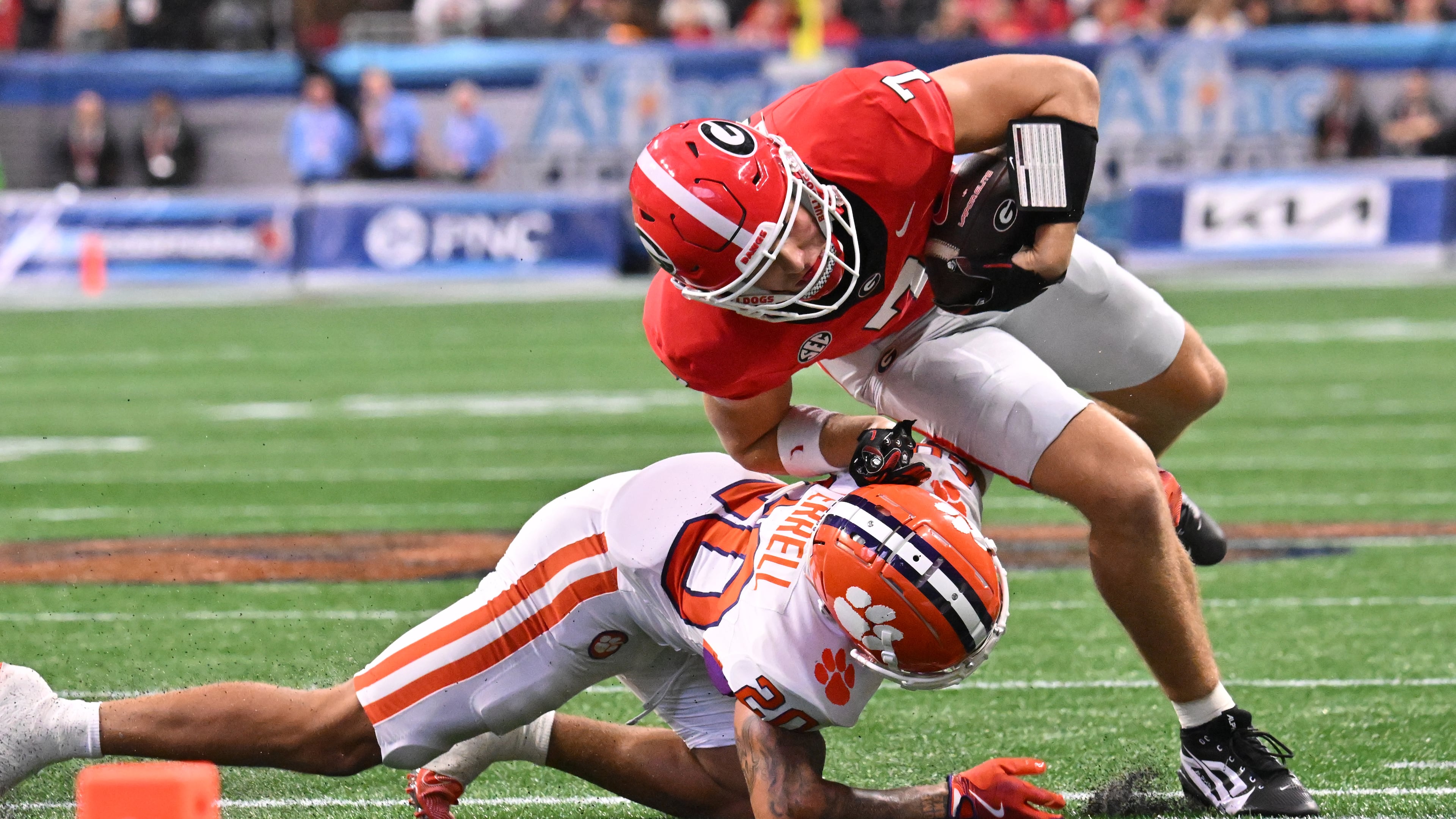 Georgia tight end Lawson Luckie (right) gets tacked by Clemson cornerback Avieon Terrell at Mercedes-Benz Stadium on Saturday, Aug. 31, 2024, in Atlanta. The Falcons selecting Terrell at No. 48 overall in the second round of the 2026 NFL draft. (Hyosub Shin/AJC 2024)