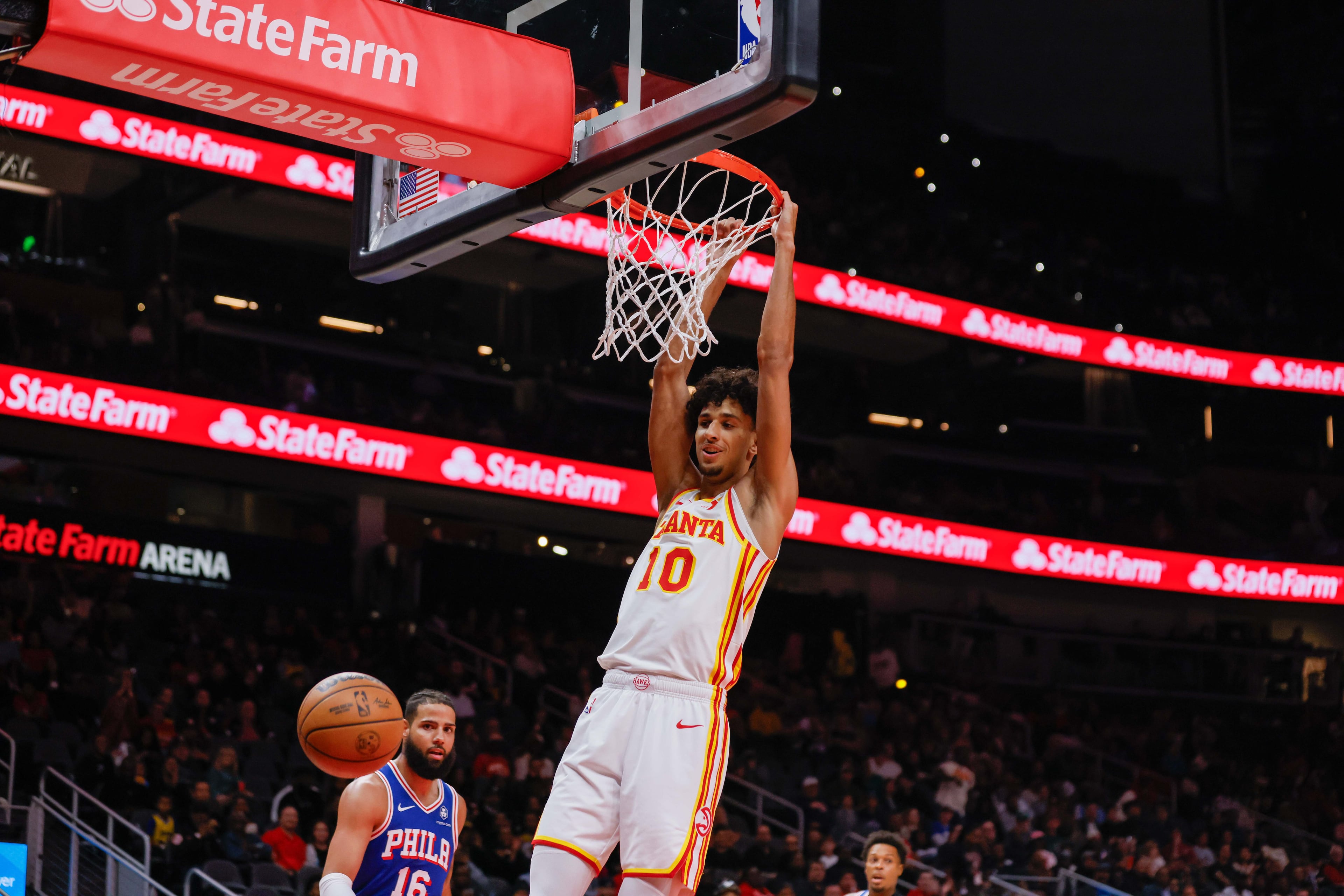 Atlanta Hawks forward Zaccharie Risacher (10) looks to the ball after a slam dunk during the first half against the Philadelphia 76rs at State Farm Arena during an NBA exhibition game on Monday, October 14, 2024, in Atlanta.(Miguel Martinez/ AJC)