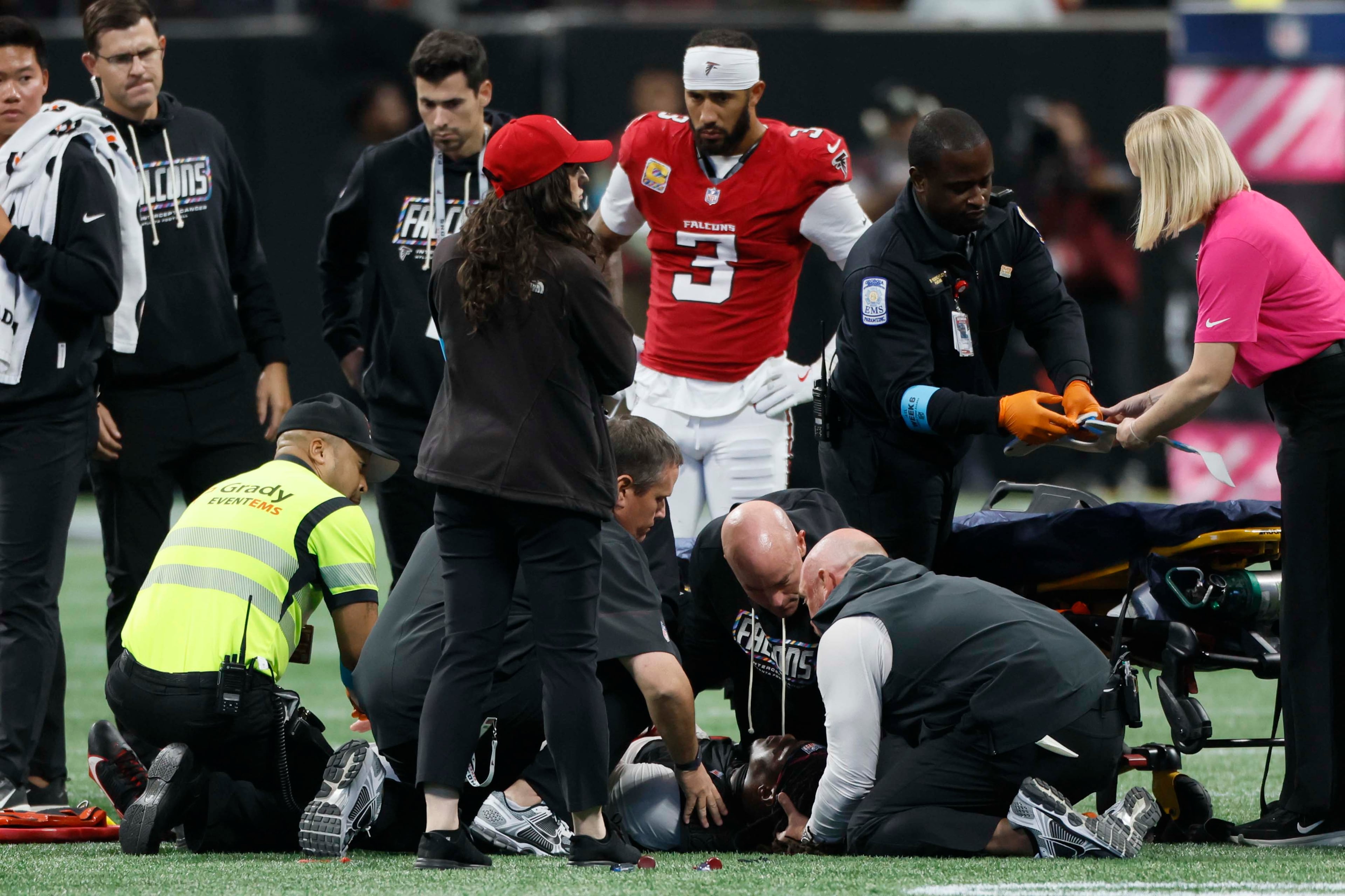 Atlanta Falcons linebacker Kendal Daniels receives medical attention from the medical staff after an injury during the second half of an NFL football game against the Chicago Bears at Mercedes-Benz Stadium in Atlanta on Sunday, Oct. 18, 2026. (Miguel Martinez/AJC)