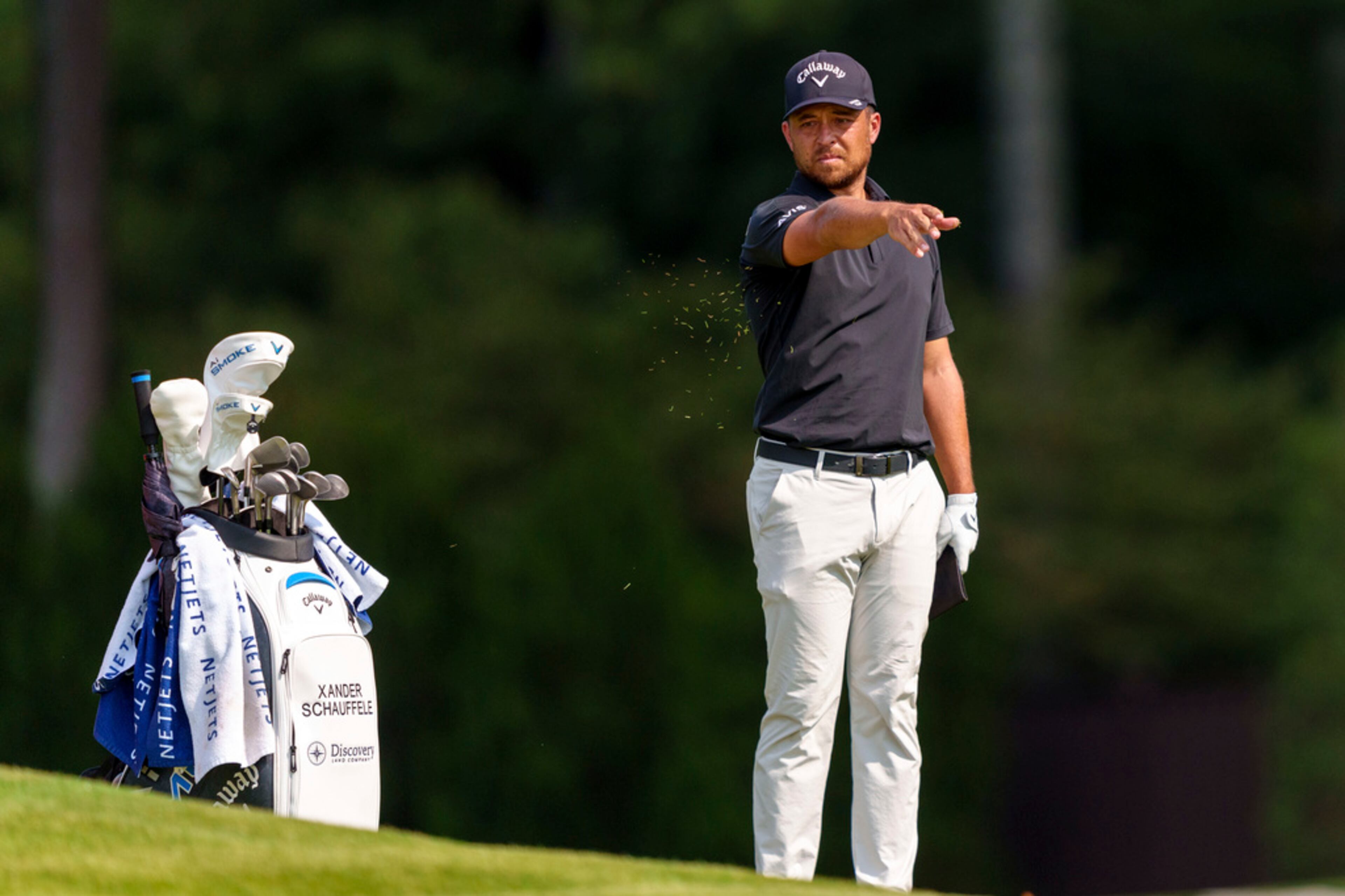 Xander Schauffele checks the wind from the fairway on hole number seven during the third round of the Tour Championship golf tournament, Saturday, Aug. 31, 2024, in Atlanta. (AP Photo/Jason Allen)
