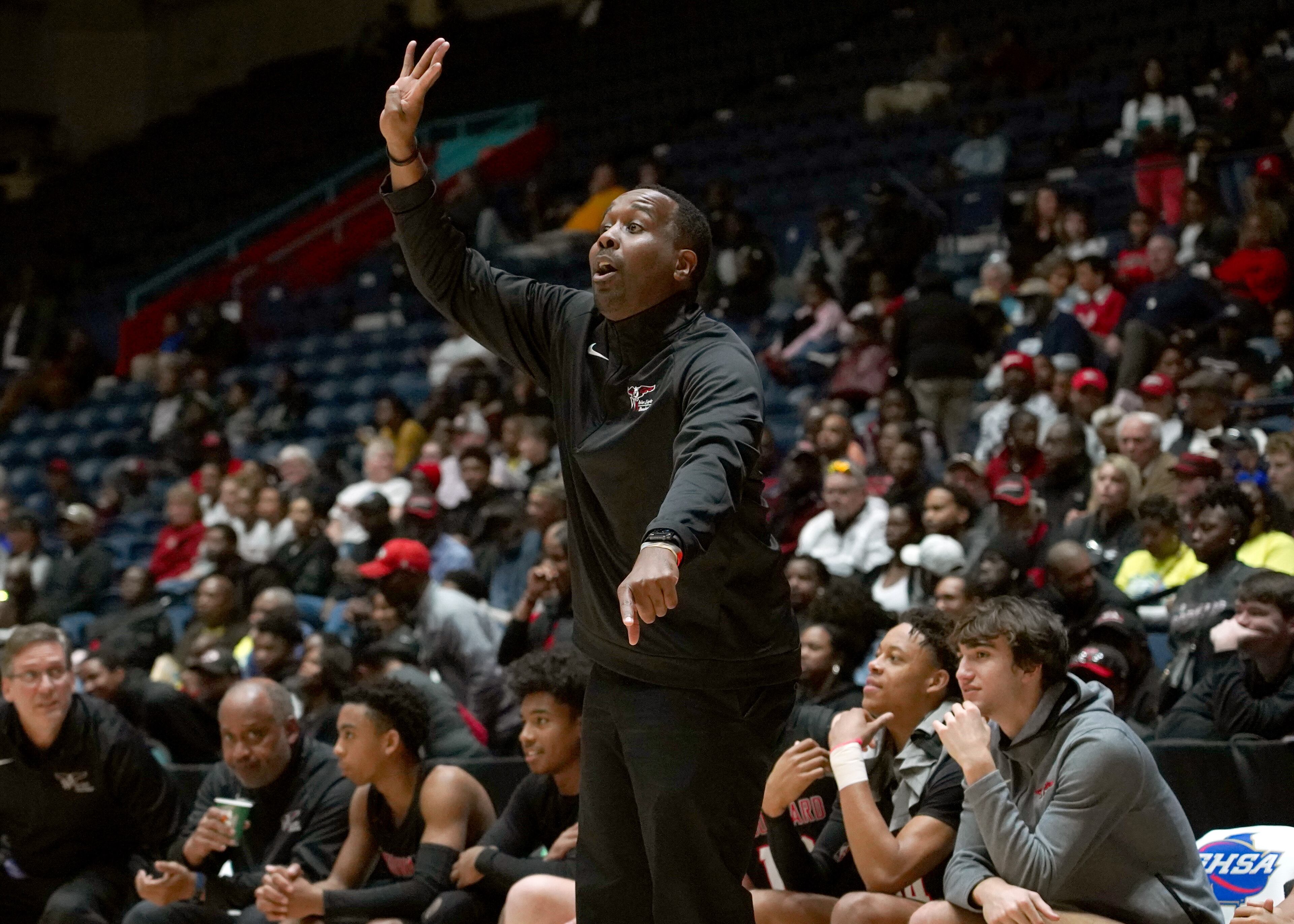 Woodward Academy's Anthony Thomas coaches from the bench against Cross Creek in the second half of the Class AAAA boys title basketball game at the Macon Centreplex, Friday March 6, 2020, in Macon. Tami Chappell for the Atlanta Journal Constitution