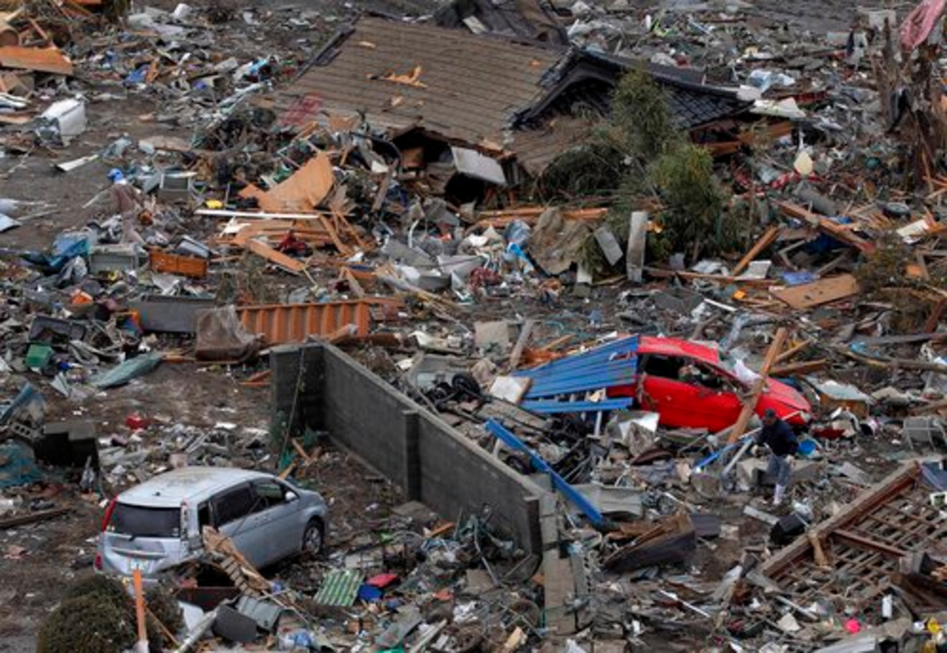 People search the tsunami-hit residential area in Ofunato, Iwate Prefecture, Japan on Tuesday.
