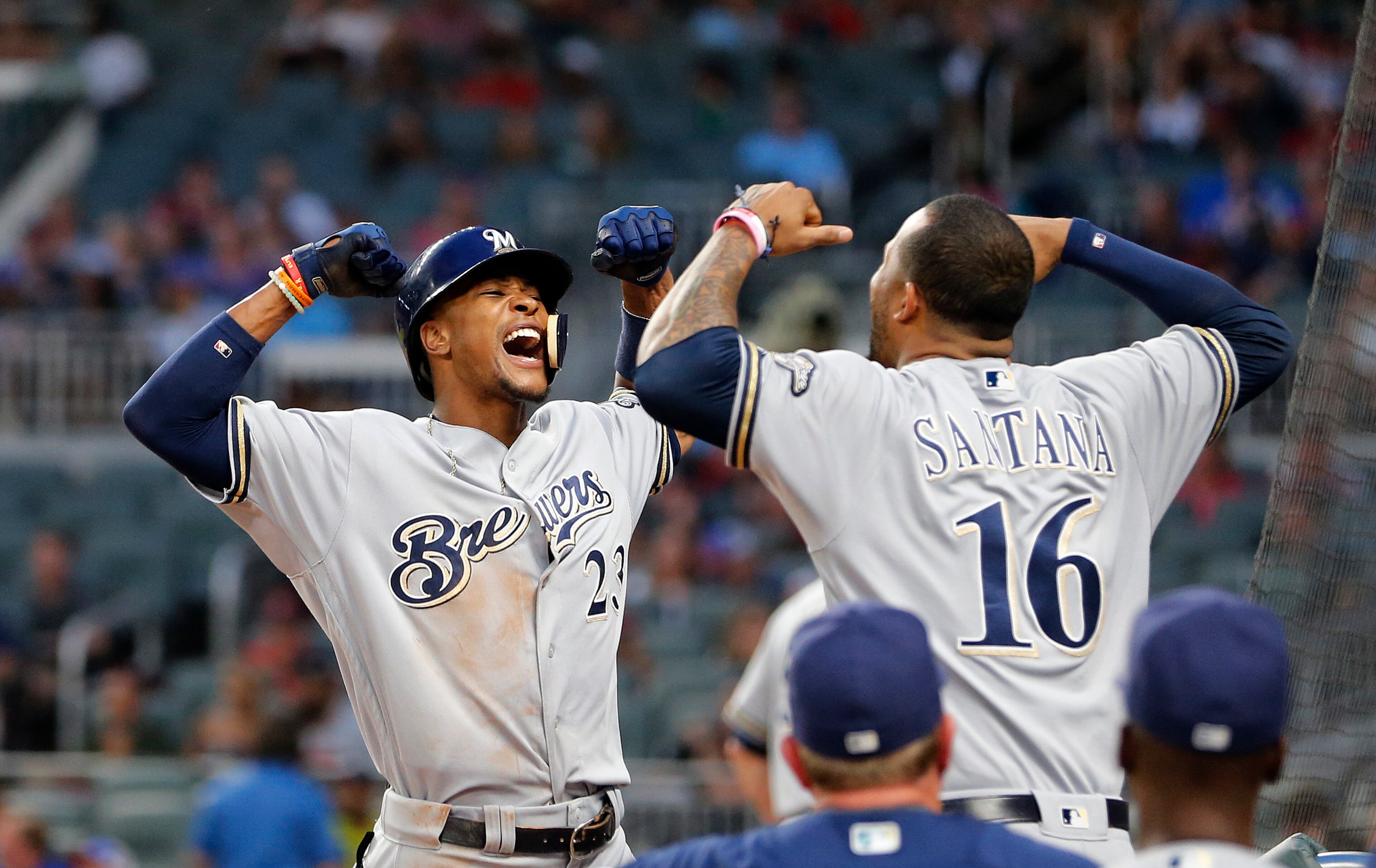 Milwaukee Brewers' Keon Broxton (23) celebrates with Domingo Santana (16) after hitting a home run during the fourth inning against the Atlanta Braves in a baseball game Friday, June 23, 2017, in Atlanta. (AP Photo/John Bazemore)