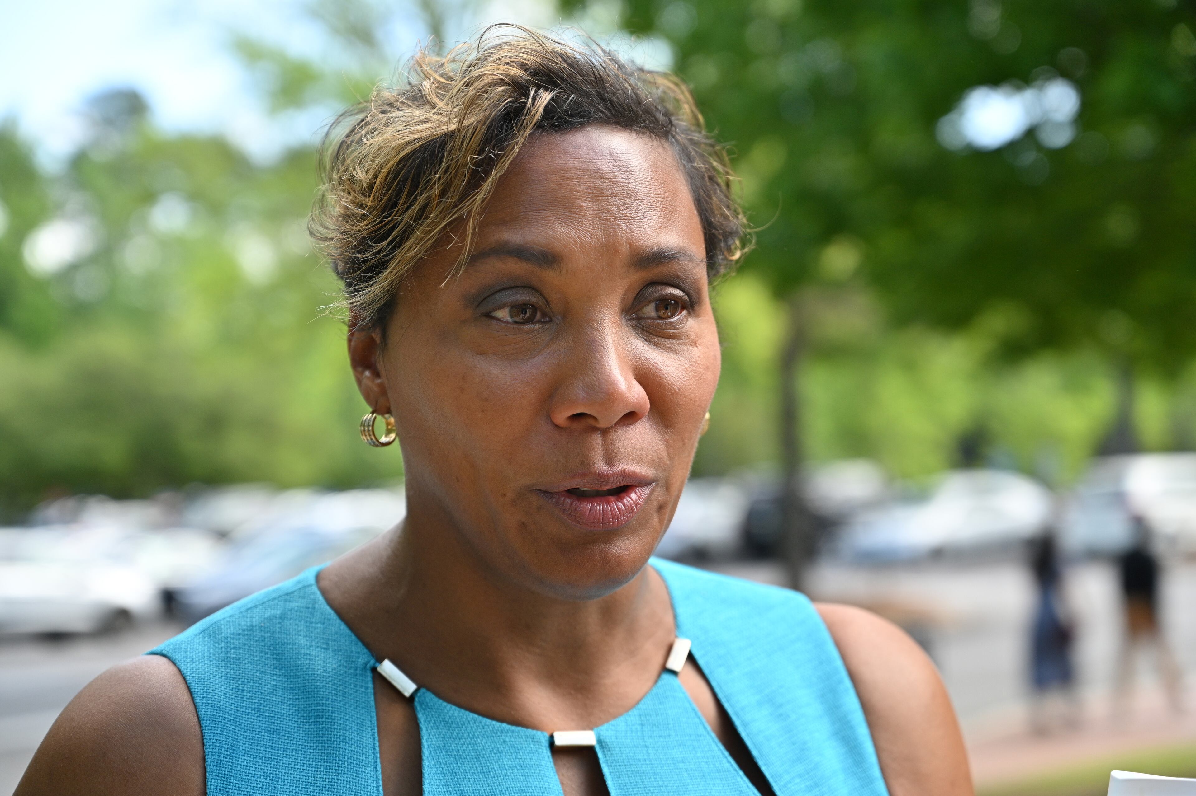 Monique Anderson Walker talks about pastor Charles Stanley outside First Baptist Atlanta where he led for more than 50 years, Saturday, April 22, 2023, in Atlanta. (Hyosub Shin / Hyosub.Shin@ajc.com)