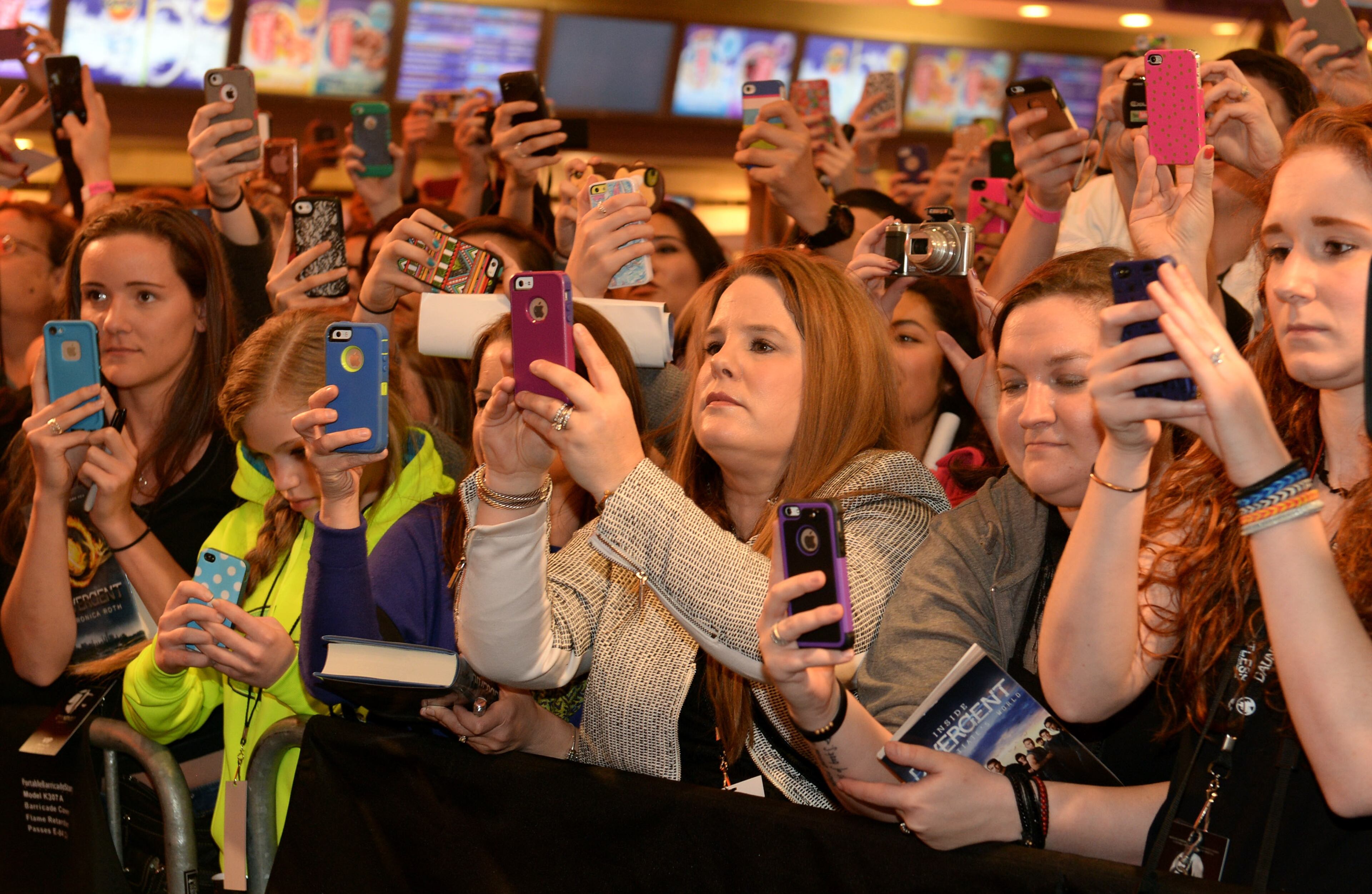 Fans react at a screening of "Divergent" March 3, 2014 at Regal Atlantic Station in Atlanta.