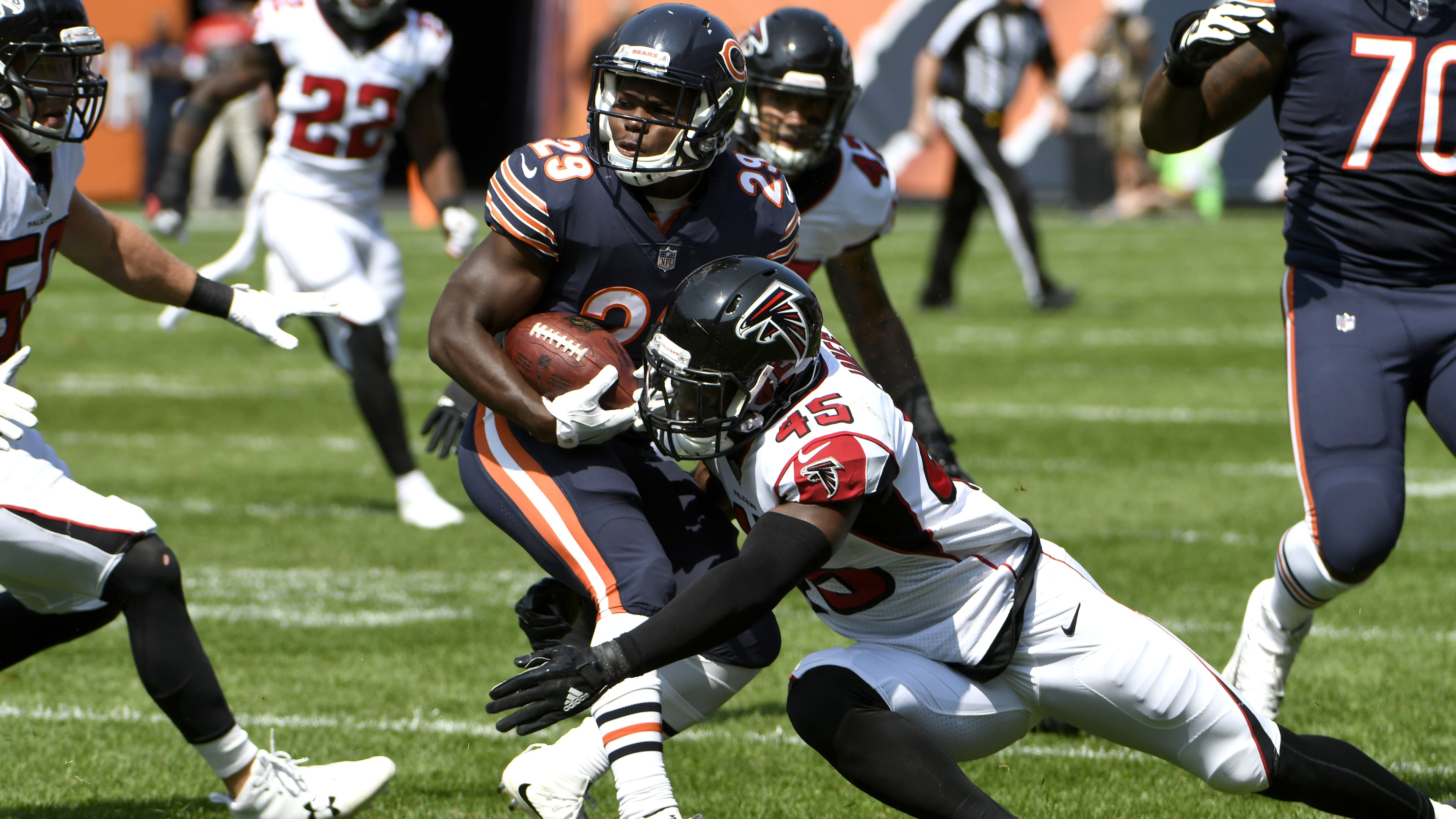 CHICAGO, IL - SEPTEMBER 10: Deion Jones #45 of the Atlanta Falcons atempts to tackle Tarik Cohen #29 of the Chicago Bears in the first quarter at Soldier Field on September 10, 2017 in Chicago, Illinois. (Photo by David Banks/Getty Images)