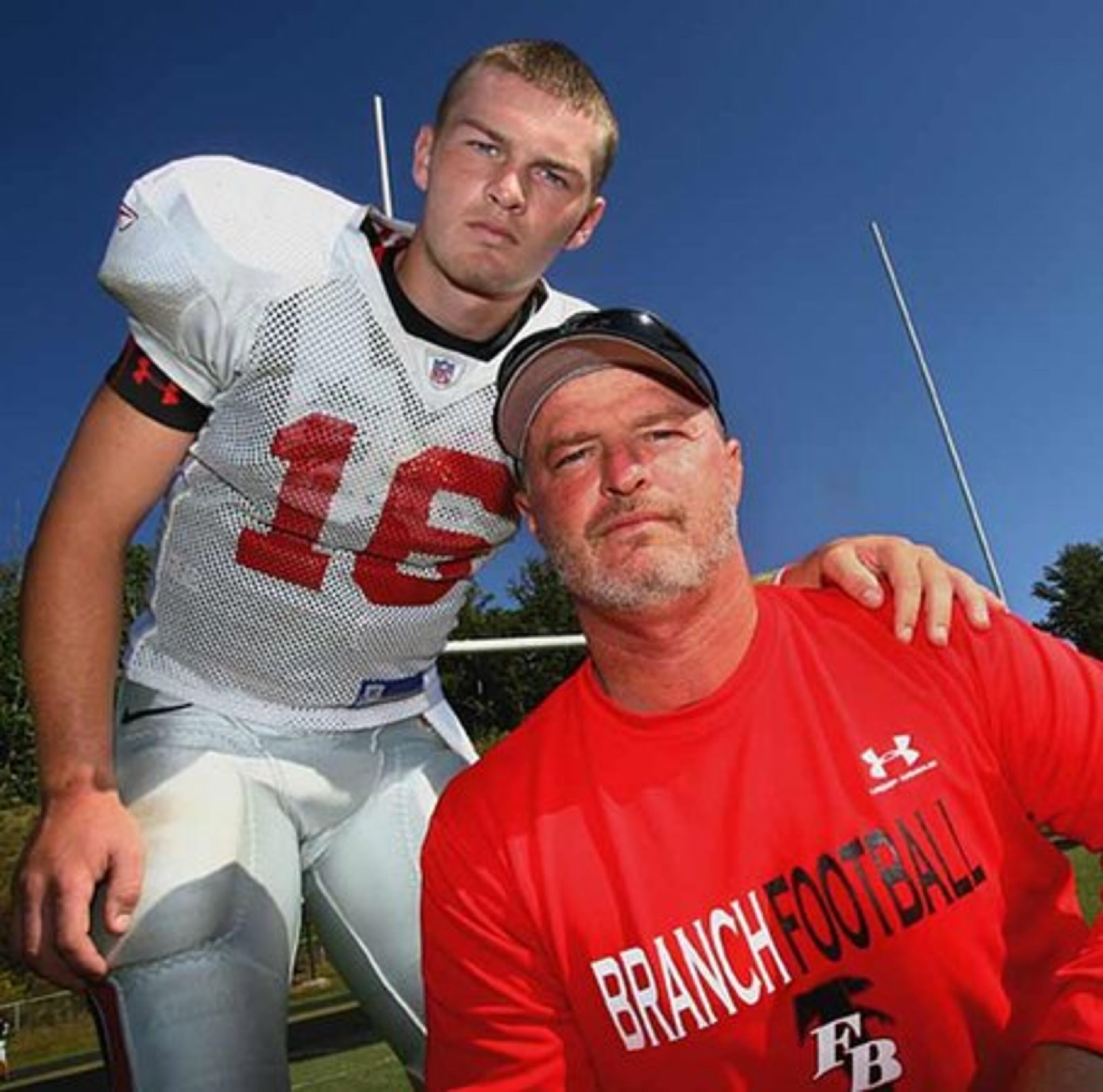 Flowery Branch head coach Lee Shaw (right), father of Georgia Tech QB Jaybo Shaw, poses with his other son, junior QB Connor Shaw (16) during practice Oct. 2, 2008.