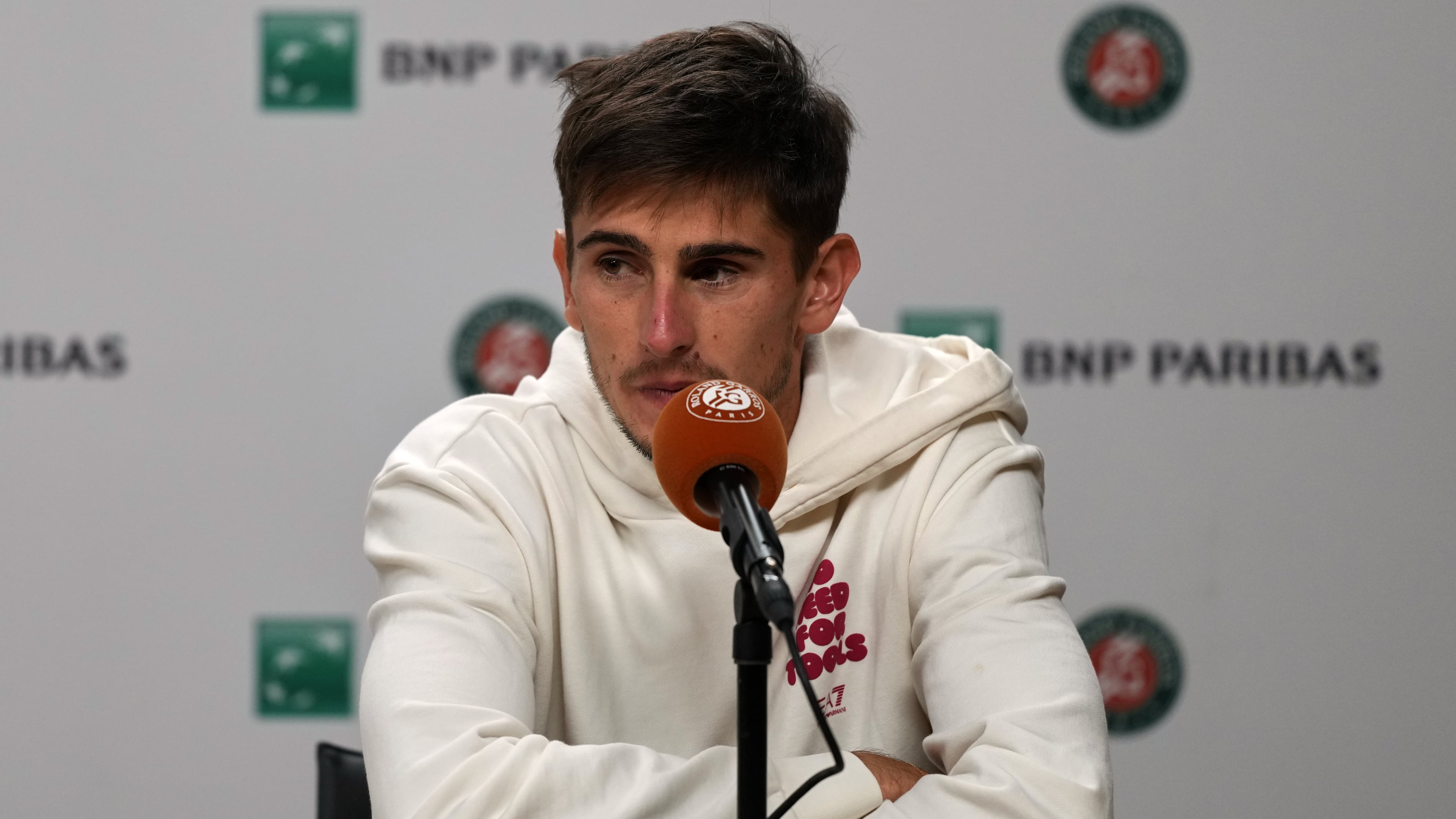 Italy's Matteo Arnaldi holds a press conference after witdrowing from a semifinal match due to an injury at the French Open in Paris, Friday, June 5, 2026. (AP Photo/Thibault Camus)