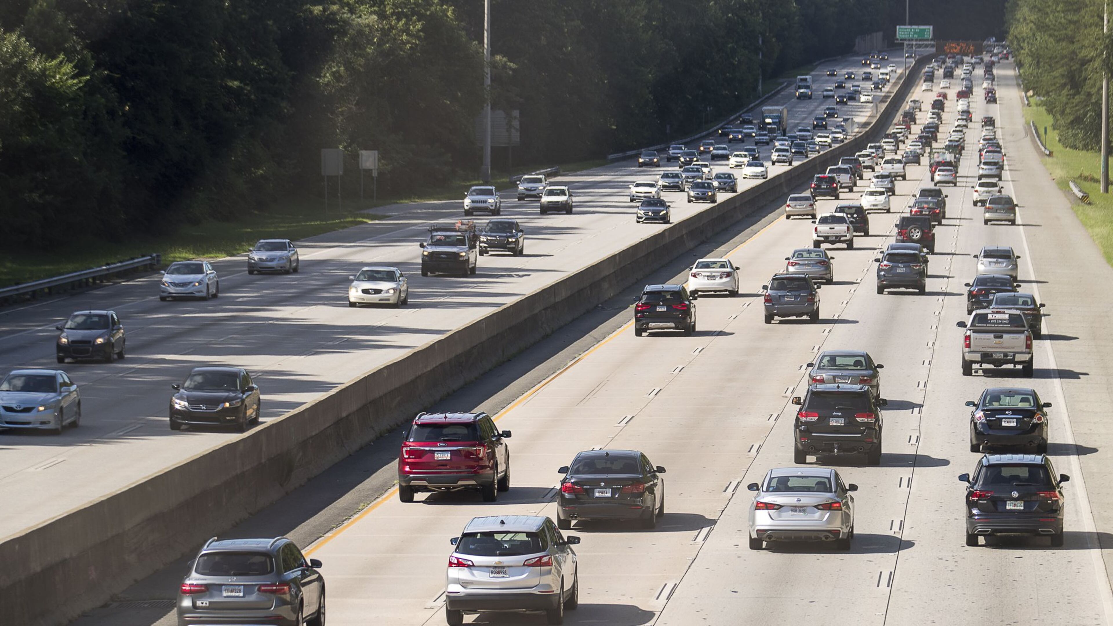Automobiles travel along Georgia 400, Tuesday, July 23, 2019. Cities along Ga. 400 are talking about petitioning the Georgia Department of Transporation to have a say in how the new highway is being designed as part of the ongoing widening project. (Alyssa Pointer/alyssa.pointer@ajc.com)