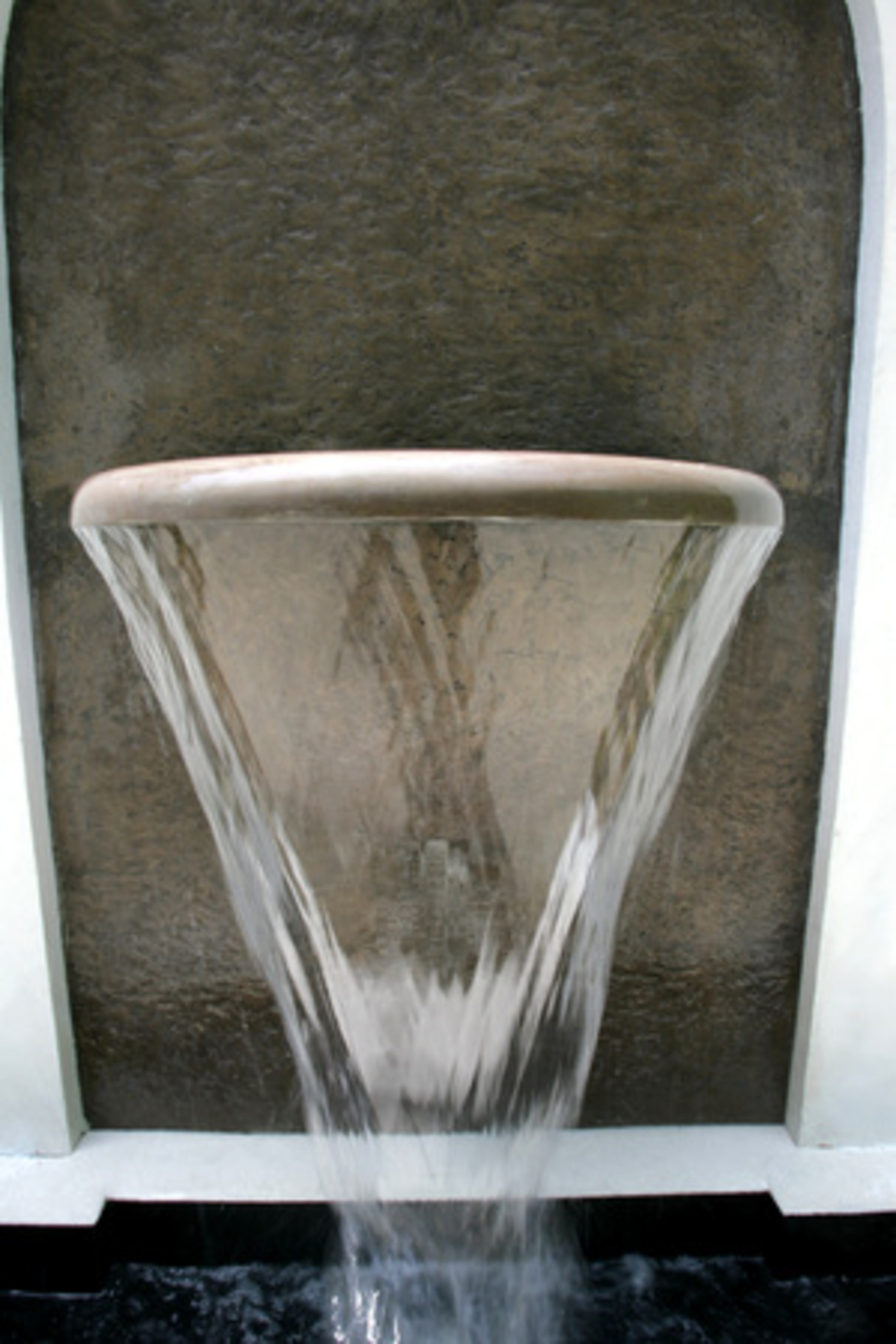 Pearson also designed this architectural flourish on the home's exterior. A gas jet inside allows the sconce to combine fire and water for a glistening elemental display.