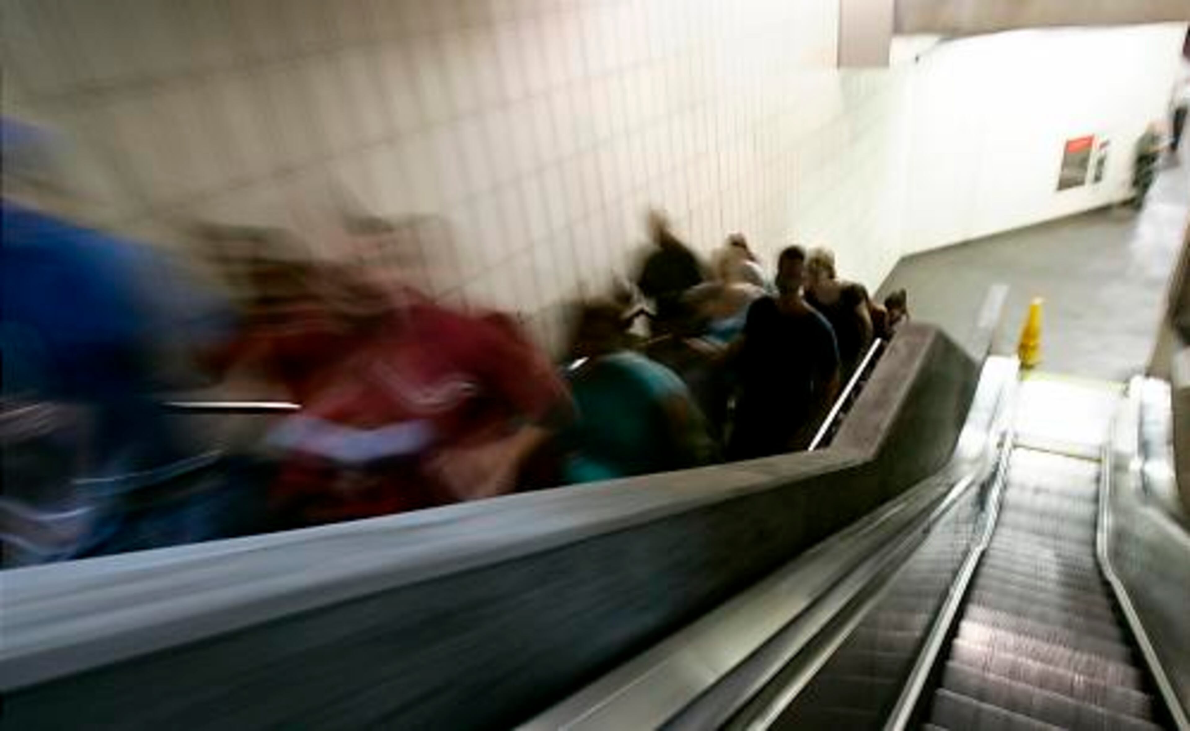 A swoosh of fans exit the 10th Street MARTA station on the way to the Piedmont Park Conservancy's Green Concert featuring the Dave Matthews Band and the Allman Brothers Band on Saturday, Sept. 8, 2007.