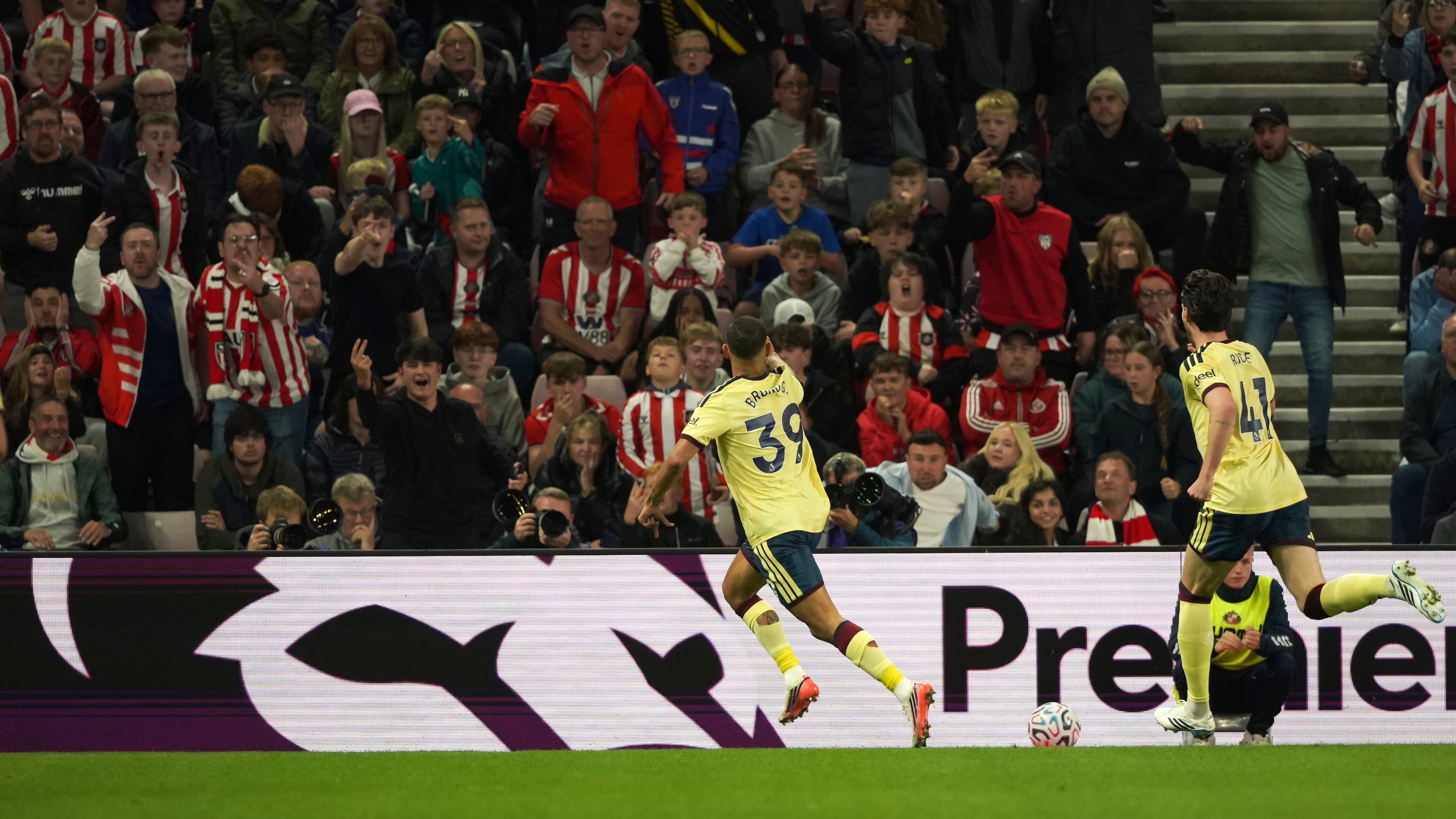 Arsenal's Bruno Guimaraes, center, celebrates after scoring the opening goal during the English Premier League soccer match between Sunderland and Arsenal in Sunderland, England, Saturday, Sept. 12, 2026. (AP Photo/Ian Hodgson)
