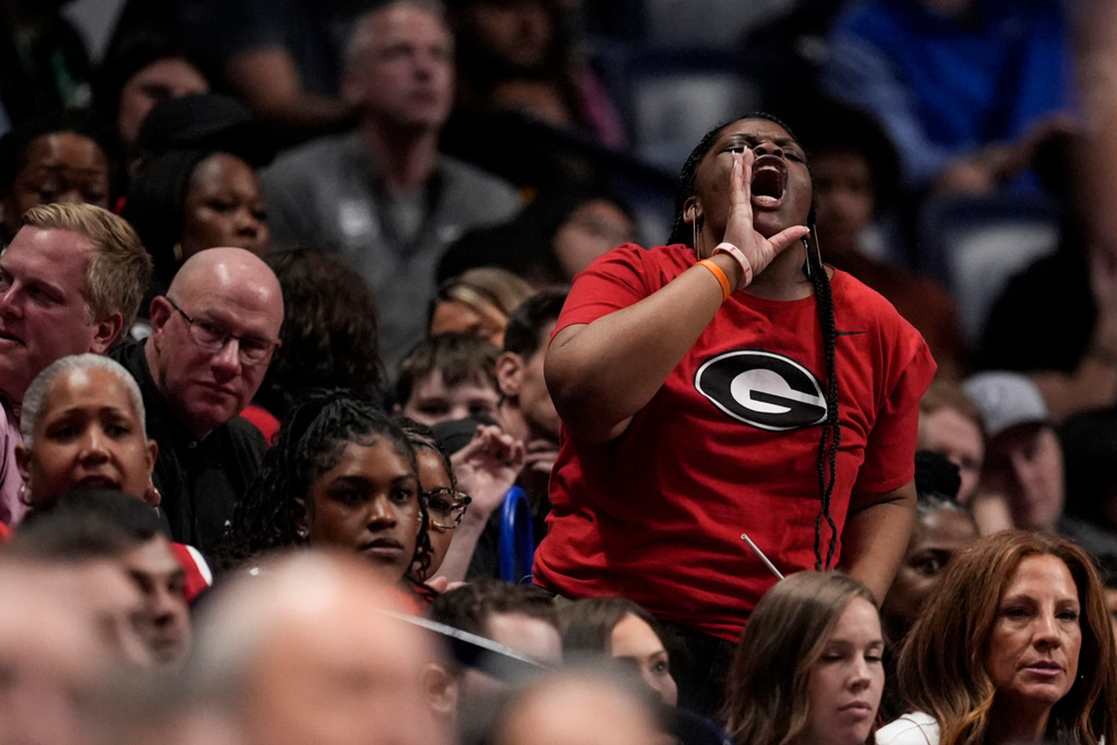 A Georgia fan speaks during the second half of an NCAA college basketball game against Oklahoma at the Southeastern Conference tournament, Wednesday, March 12, 2025, in Nashville, Tenn. (AP Photo/George Walker IV)