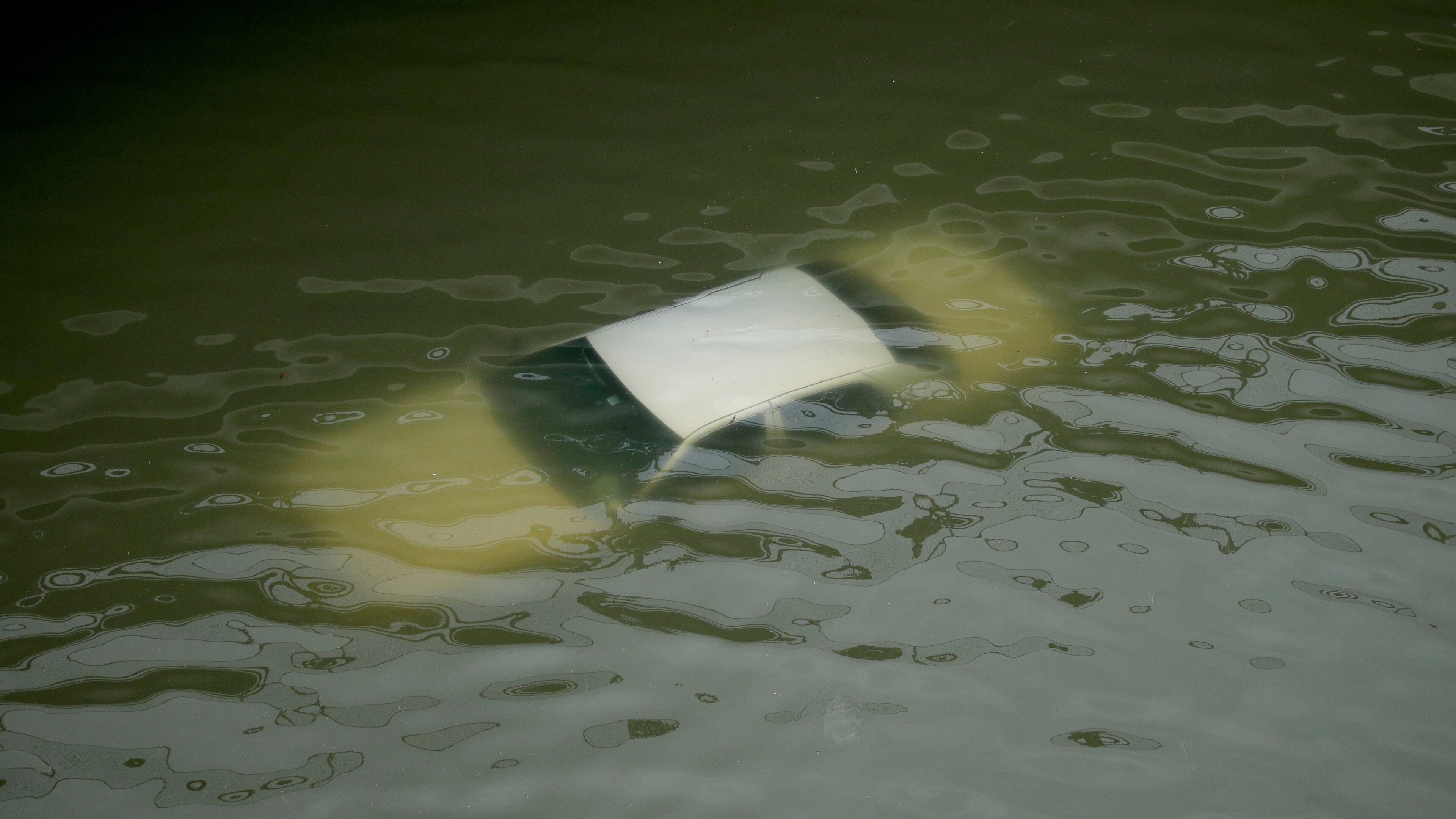 A car is submerged on a freeway flooded by Tropical Storm Harvey on Sunday, near downtown Houston. AP/Charlie Riedel