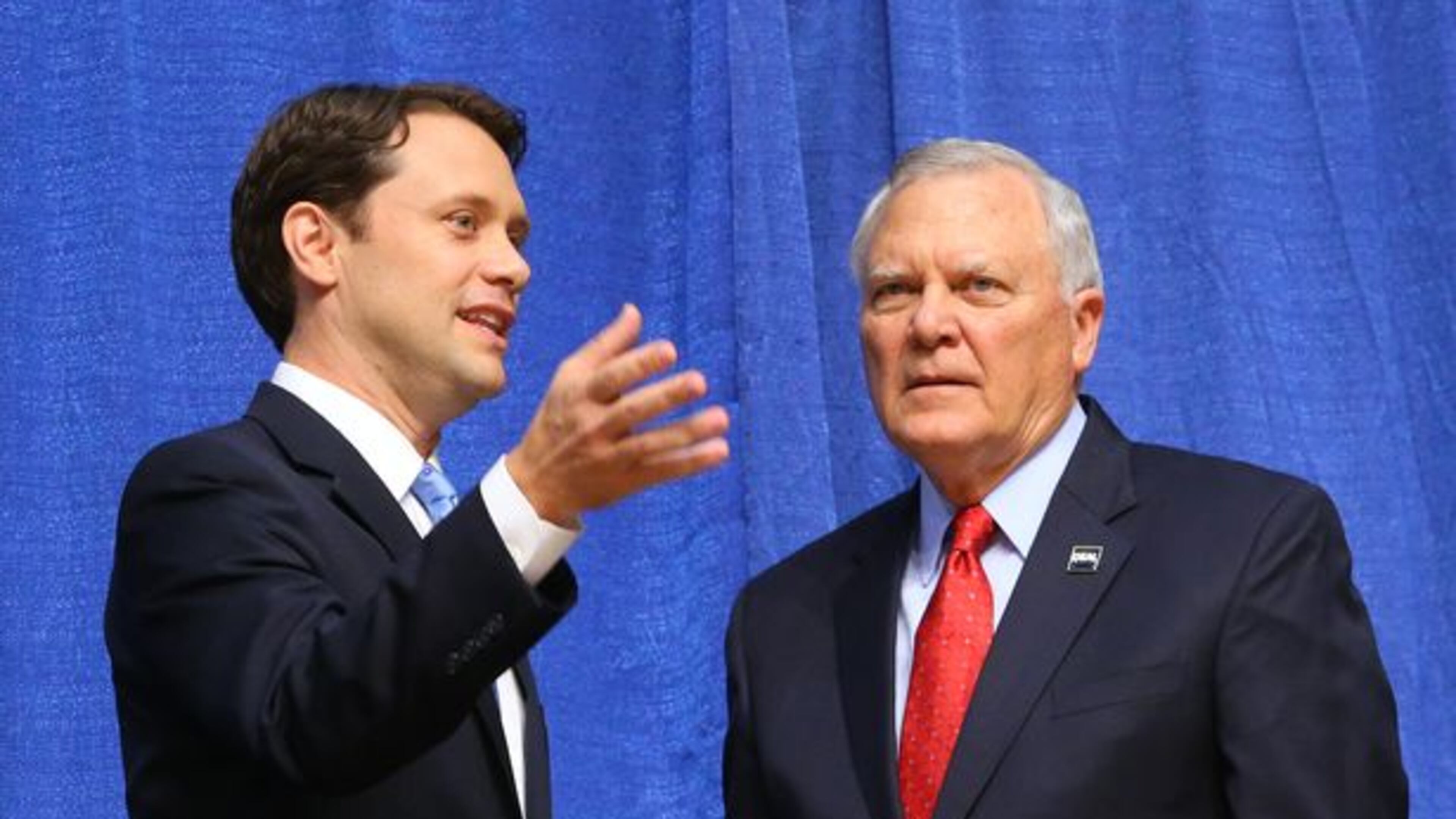 Gov. Nathan Deal and Democrat Jason Carter talk before a debate.