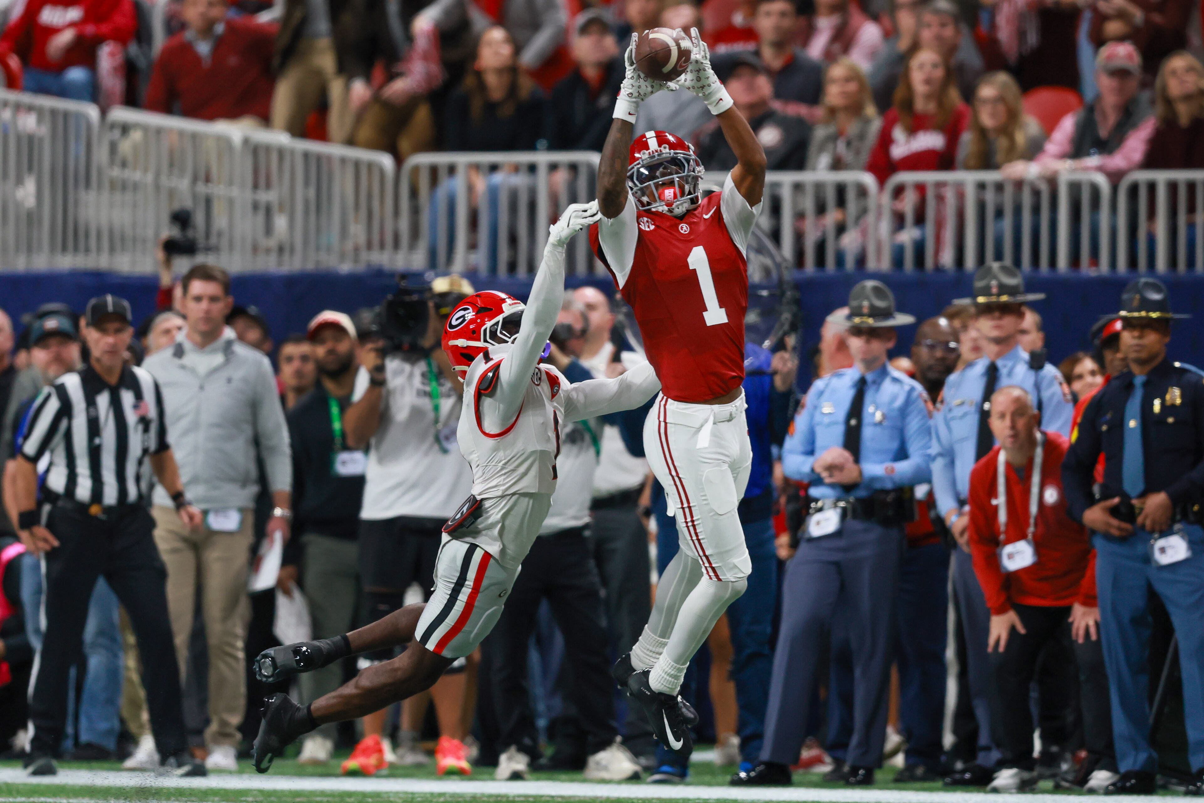 Alabama wide receiver Isaiah Horton (1) makes a catch in front of Georgia defensive back Ellis Robinson IV (1) during the first half of the SEC Championship game at Mercedes-Benz Stadium, Saturday, Dec. 6, 2025, in Atlanta. (Jason Getz / AJC)