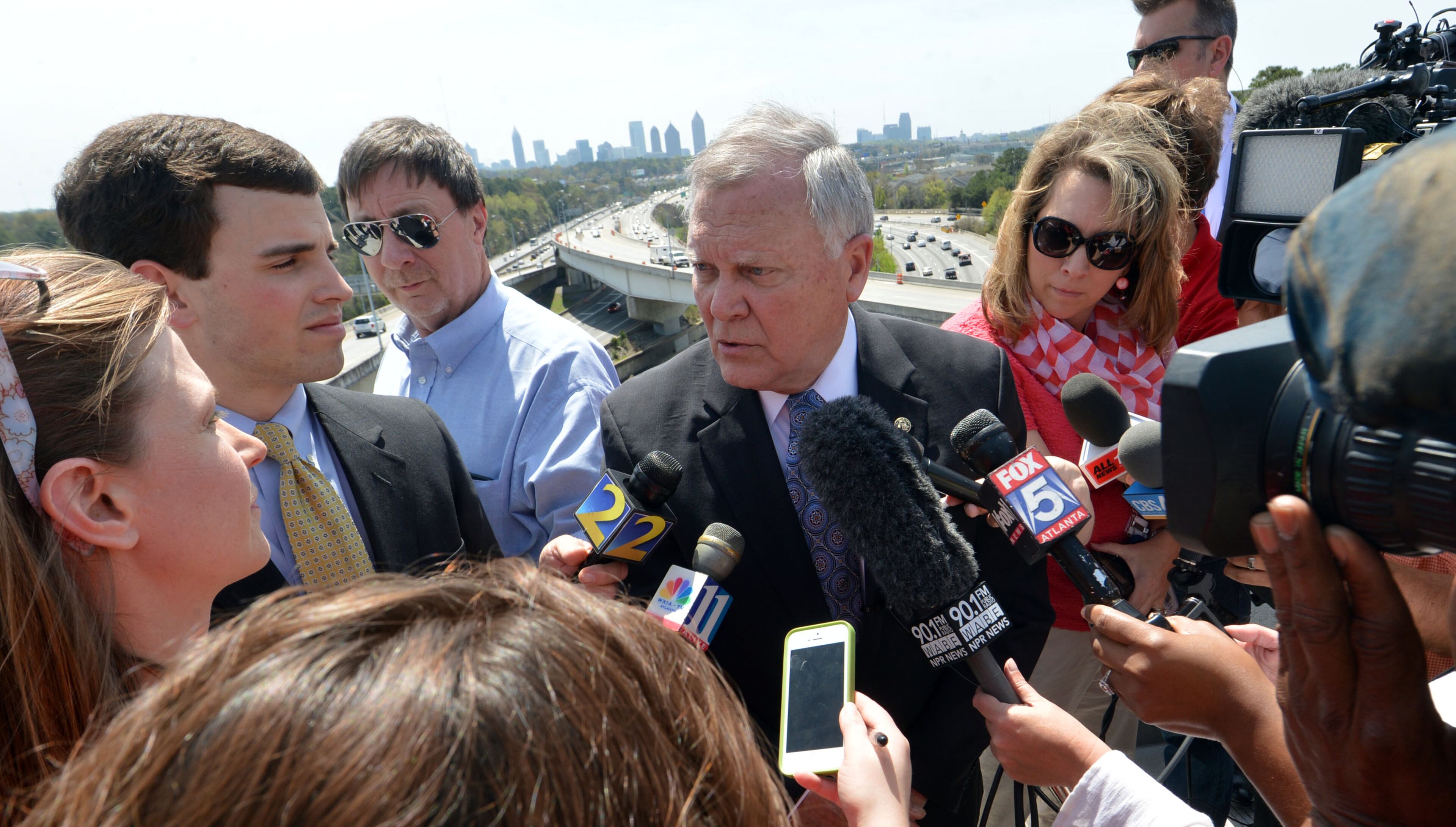 Governor Nathan Deal talks with the media following the program. Deal and other state and local leaders conducted a brief ribbon-cutting celebration of the opening of the new flyover ramps Wednesday, April 2, 2014. The ramps provide I-85 southbound traffic with direct access to GA 400 northbound and also give GA 400 southbound motorists a direct ramp to I-85 northbound.