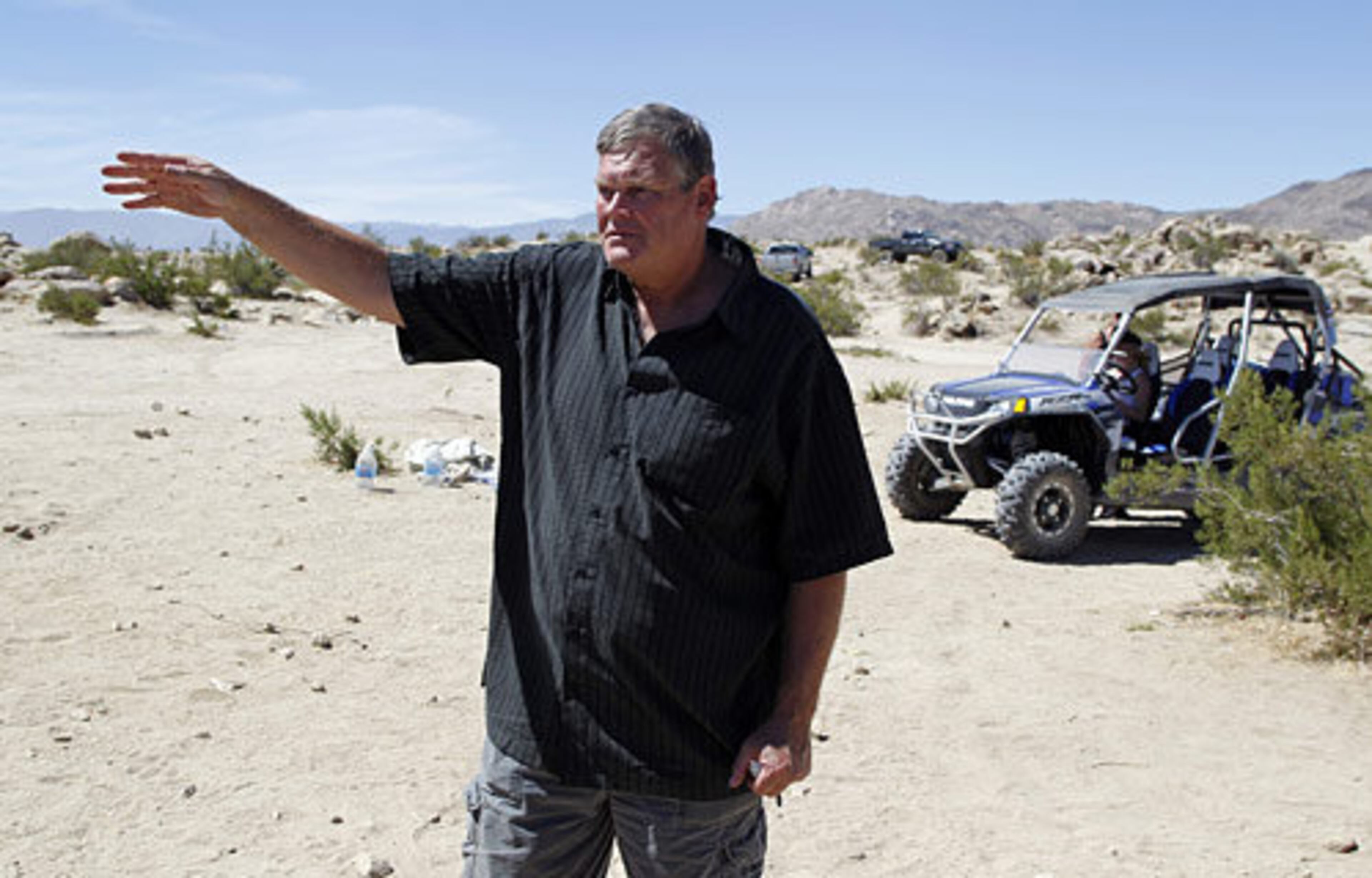 Randall Peterson of Fillmore, Calif., points to where the off-road race truck went out of control and ran into a crowd of spectators, including his stepson, Zachary Freeman.