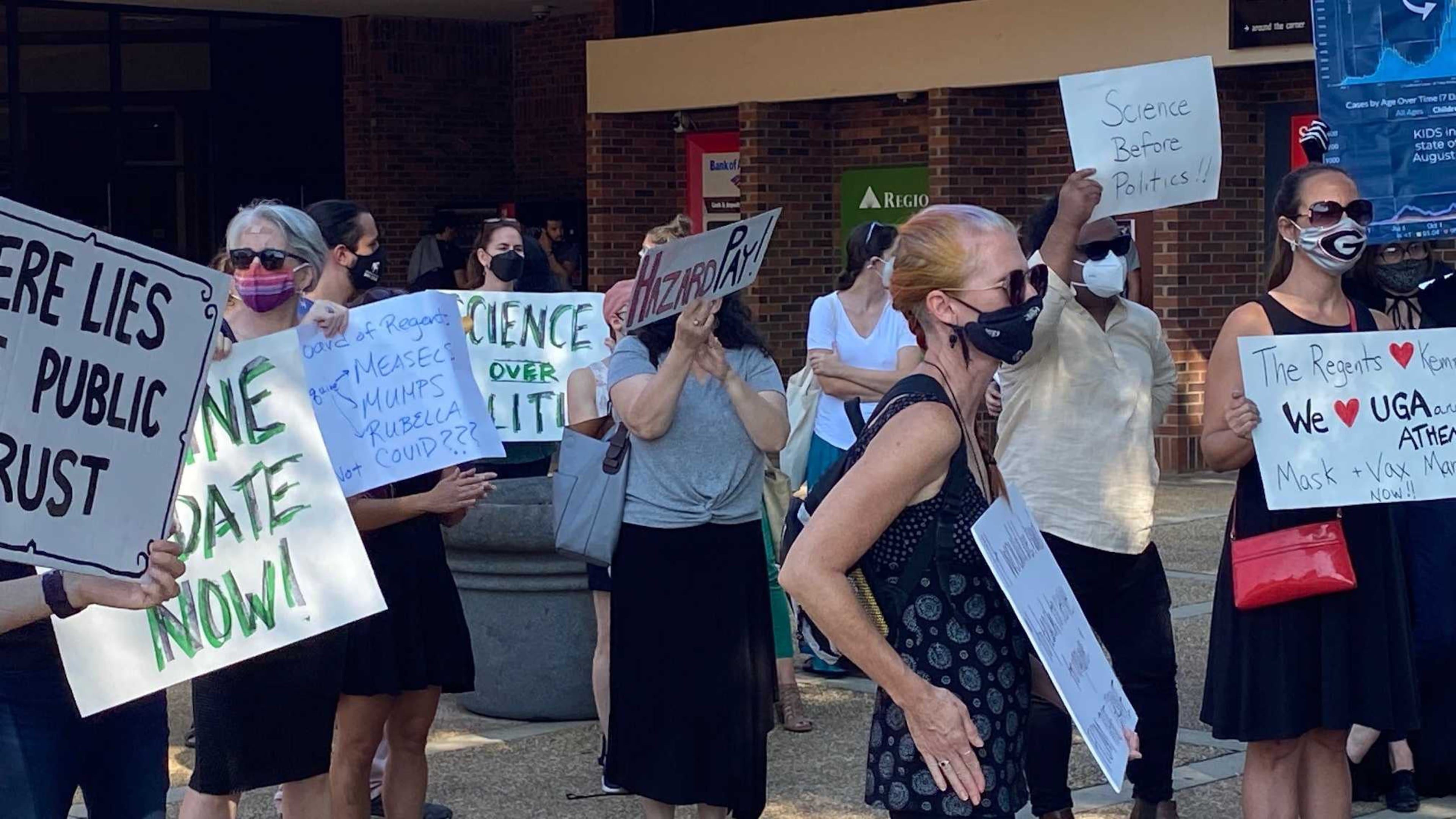 University of Georgia faculty members and employees gathered outside the Tate Student Center on Sept. 14, 2021 for a rally for mandates and other measures to mitigate the spread of COVID-19 on campus. ERIC STIRGUS/ERIC.STIRGUS@AJC.COM.