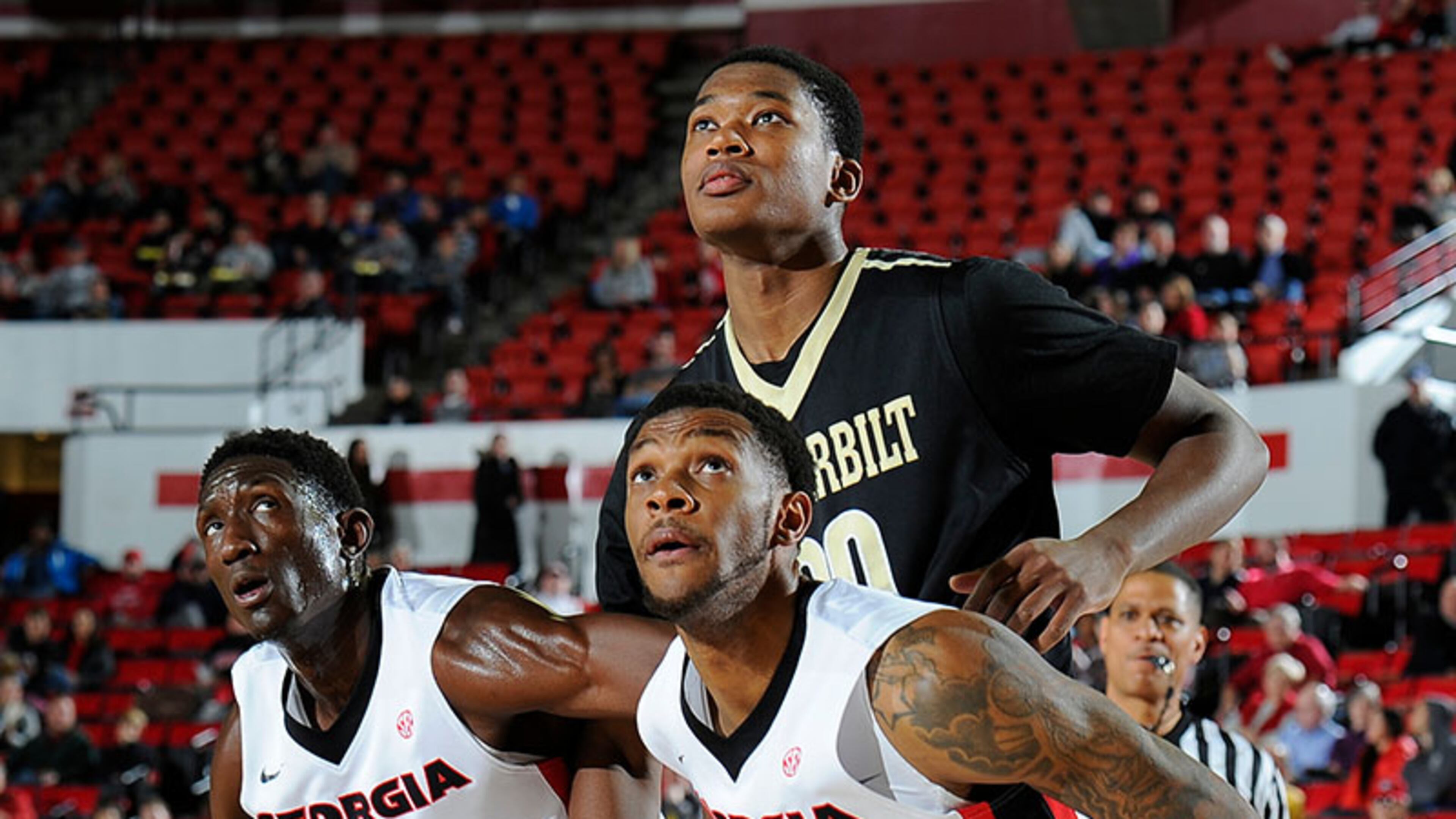 Brandon Morris (31) and Donte' Williams (15) get in position for a rebound during Georgia's game Wednesday against Vanderbilt at Stegeman Coliseum in Athens. Georgia lost 59-54.