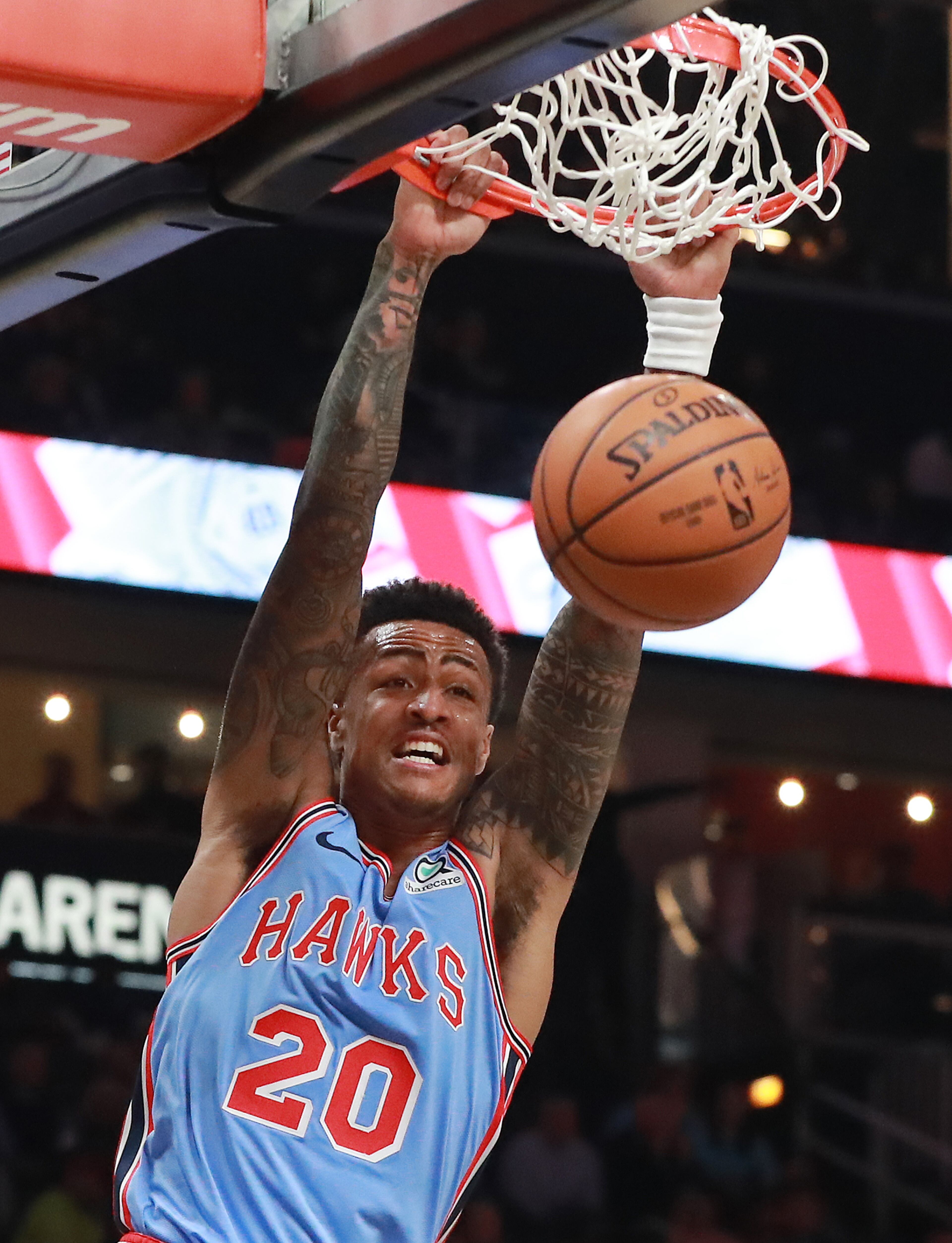 Jan. 15, 2019 Atlanta: Atlanta Hawks forward John Collins slams for two against the Oklahoma City Thunder during the first half in a NBA basketball game on Tuesday, Jan. 15, 2019, at State Farm Arena in Atlanta. Curtis Compton/ccompton@ajc.com