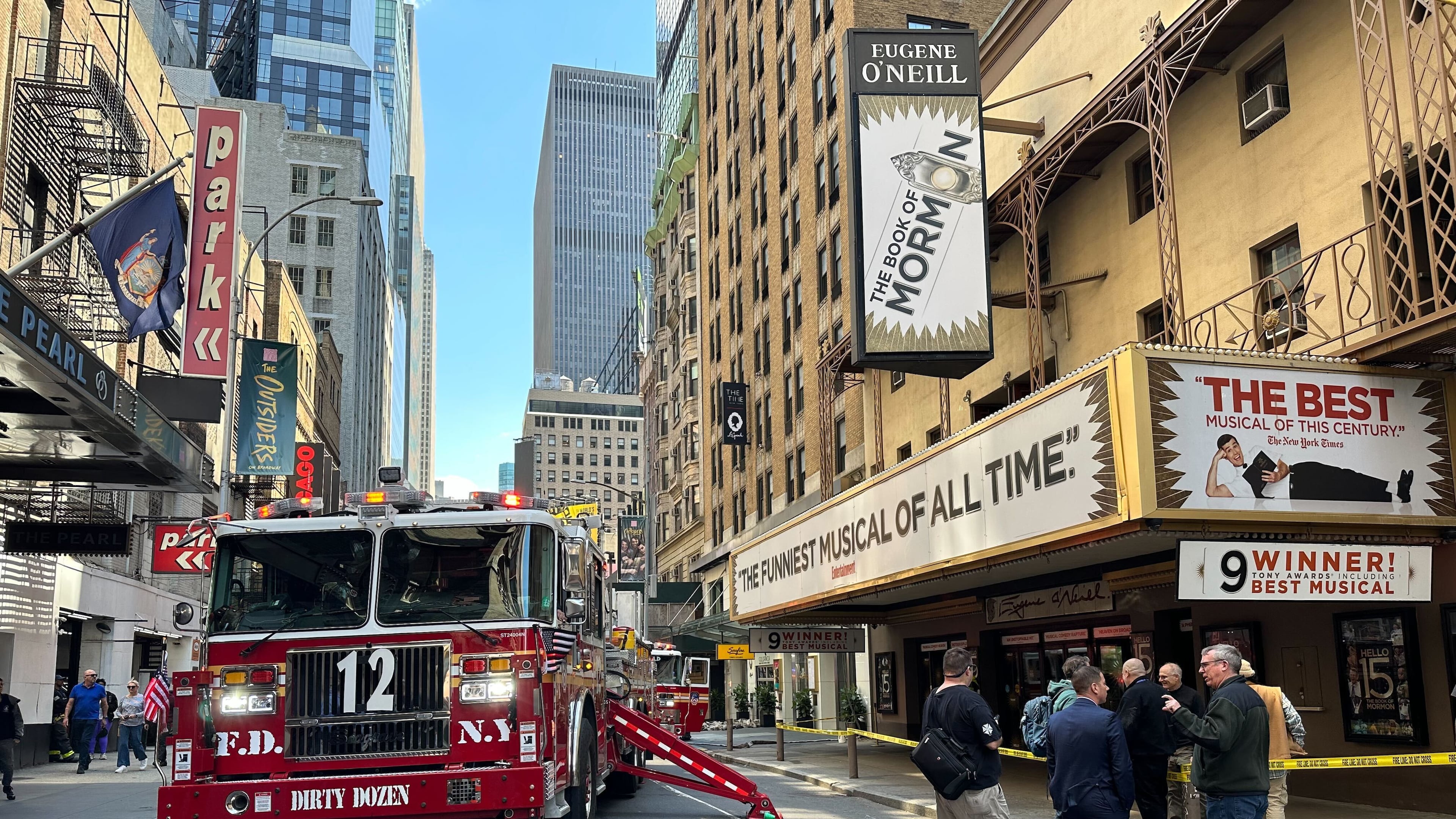 Firetrucks are parked outside of the Eugene O'Neill Theatre in New York on Monday, May 4, 2026. (AP Photo/David Martin)
