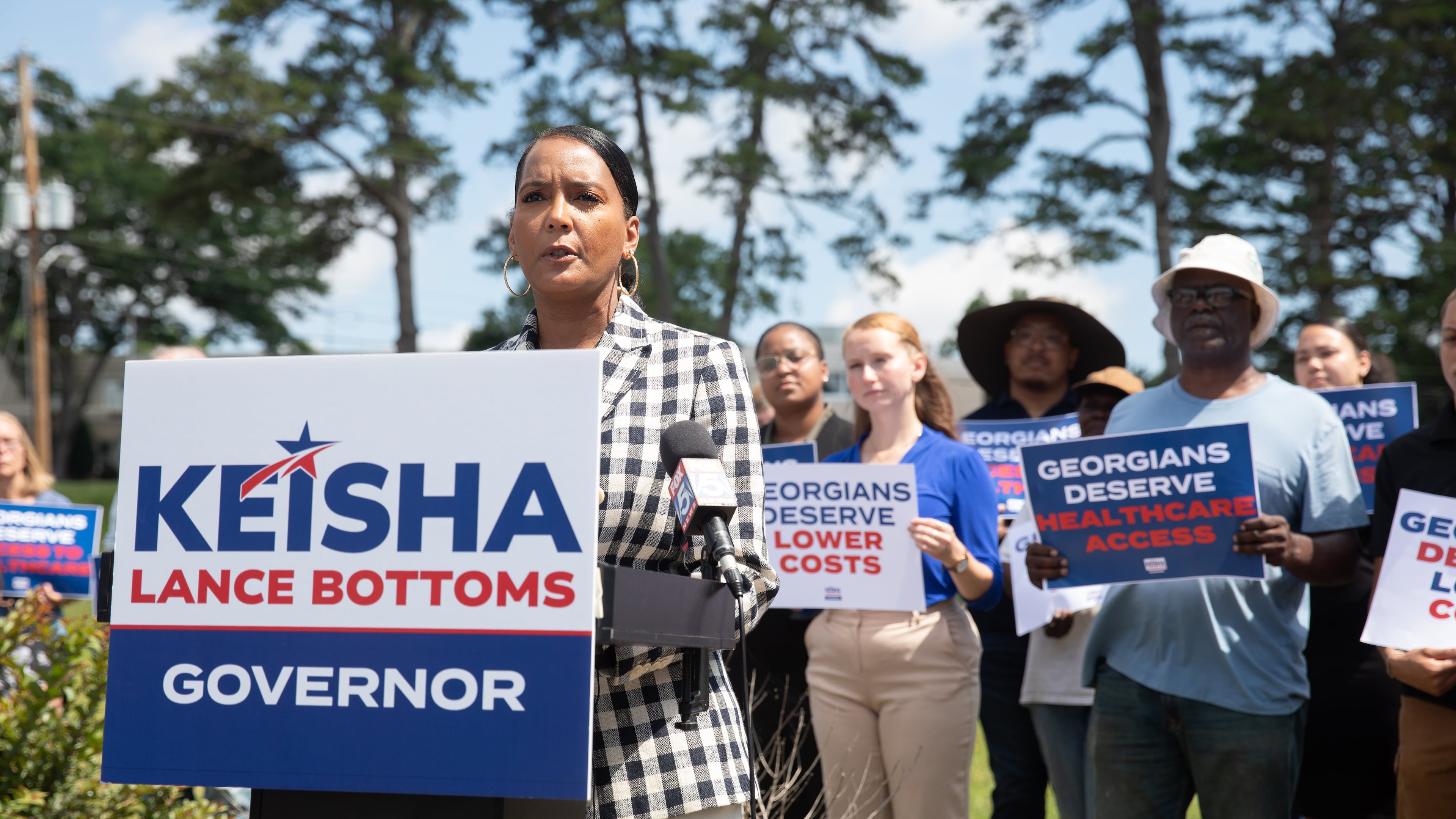 Former Atlanta mayor and Democratic nominee for governor Keisha Lance Bottoms campaigns outside of a shuttered rural hospital in Commerce in June. (Riley Bunch/AJC)