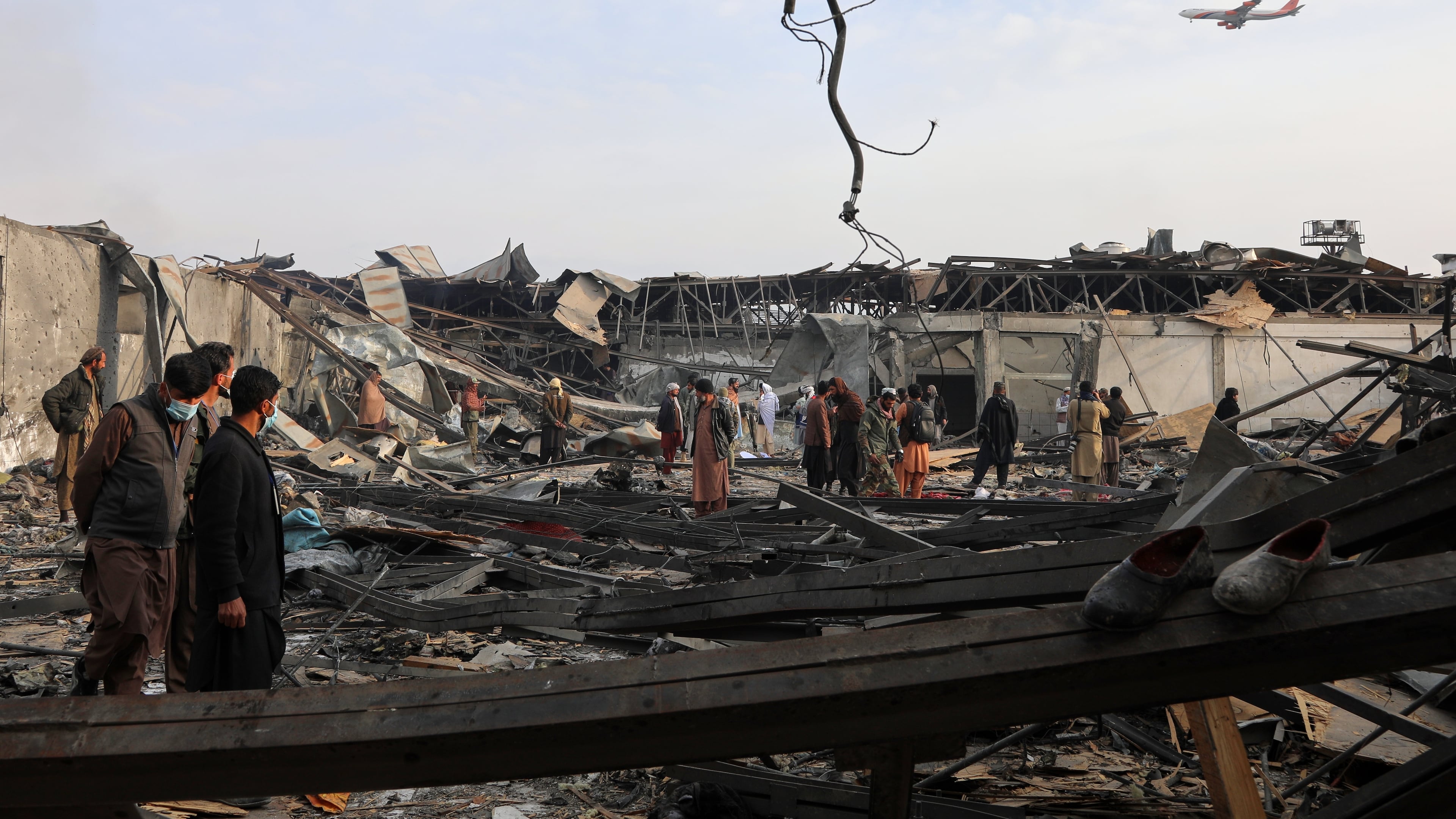 Residents and volunteers inspect the site of a late-Monday airstrike at a drug rehabilitation hospital in Kabul, Afghanistan, Tuesday, March 17, 2026. (AP Photo/Siddiqullah Alizai)