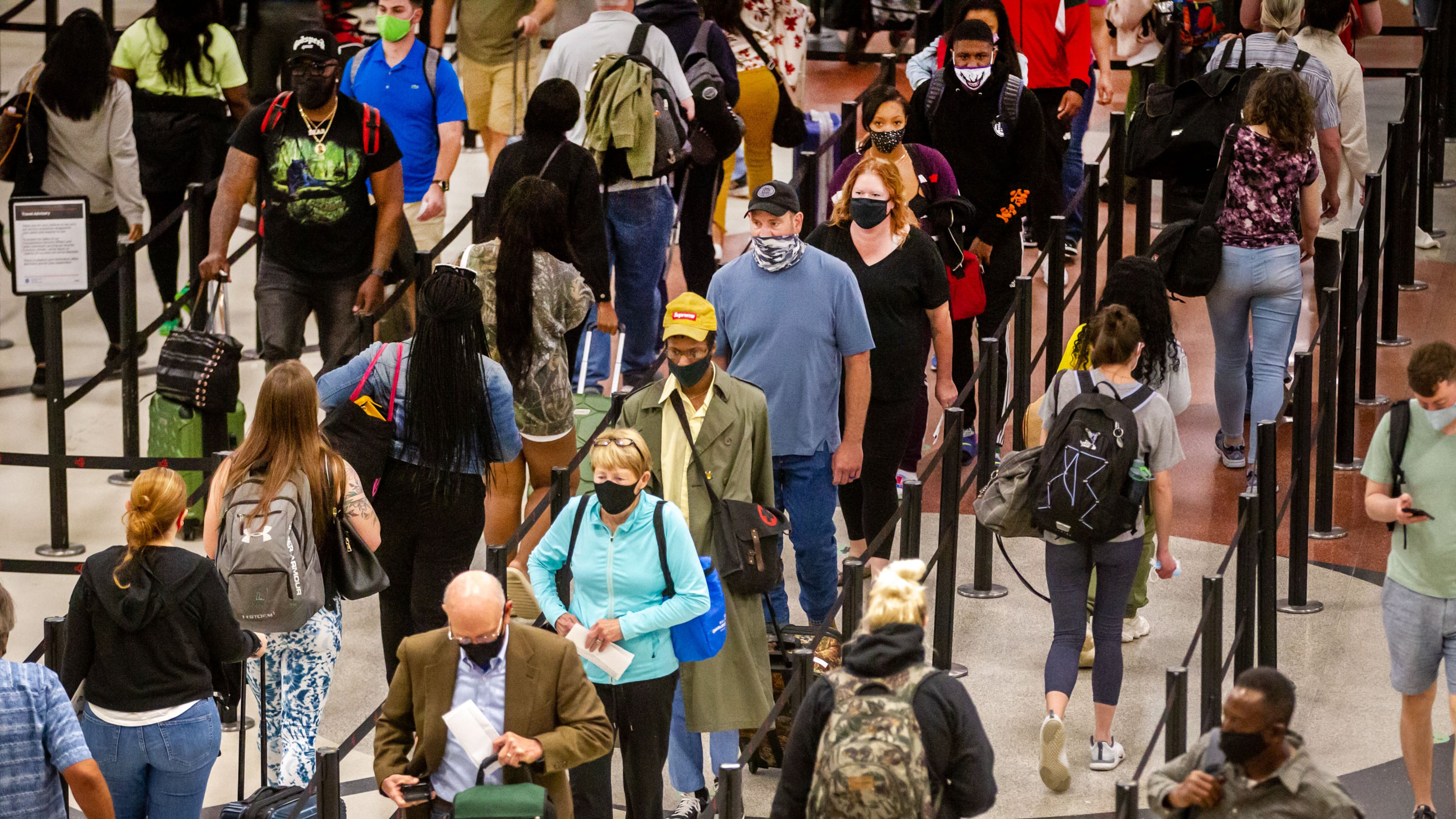 Long lines form at Hartsfield-Jackson Atlanta International Airport Sunday, May 9, 2021. STEVE SCHAEFER FOR THE ATLANTA JOURNAL-CONSTITUTION
