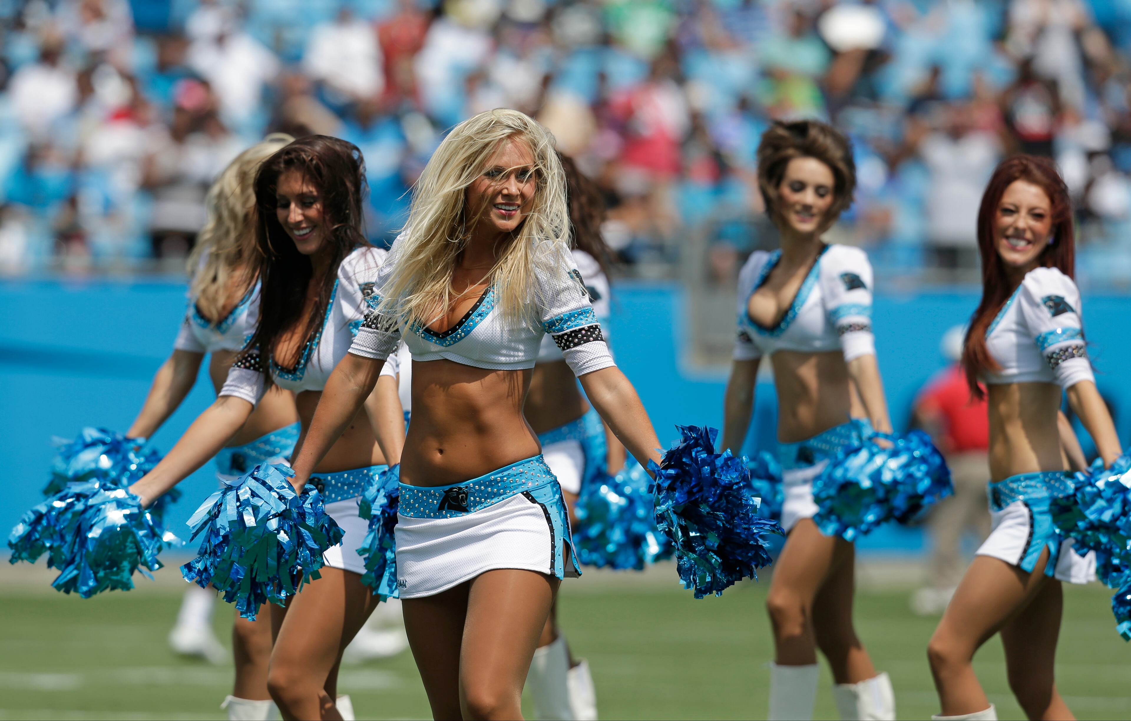 Carolina Panthers cheerleaders perform during an NFL football training camp practice as part of the team's Fan Fest in Charlotte, N.C., Saturday, Aug. 3, 2013.