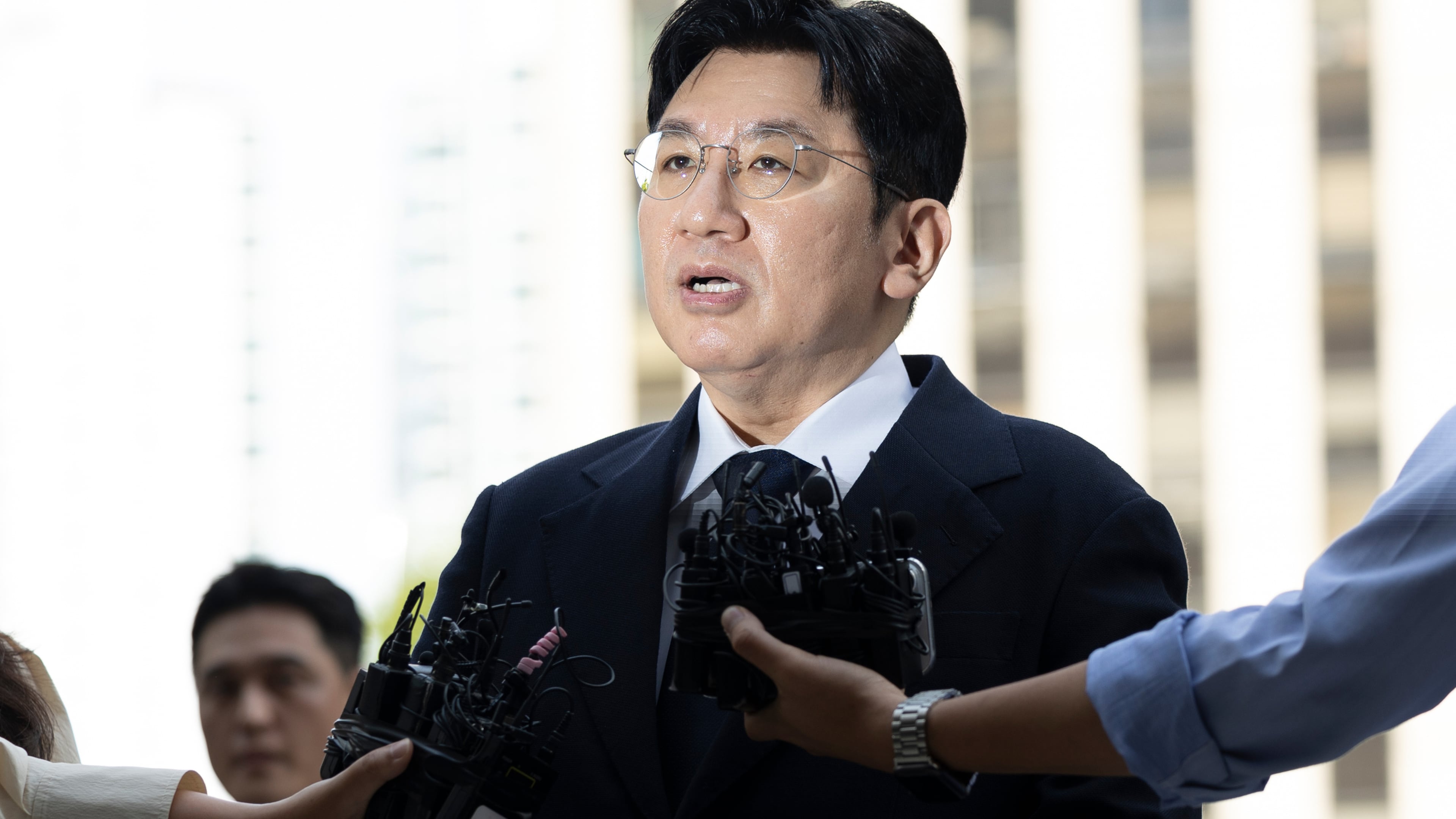 FILE - Bang Si-Hyuk, a chairman of Hybe, answers reporters' question upon his arrival at the Seoul Metropolitan Police Agency in Seoul, South Korea, on Sept. 15, 2025. (Kim Keun-soo/Newsis via AP, File)
