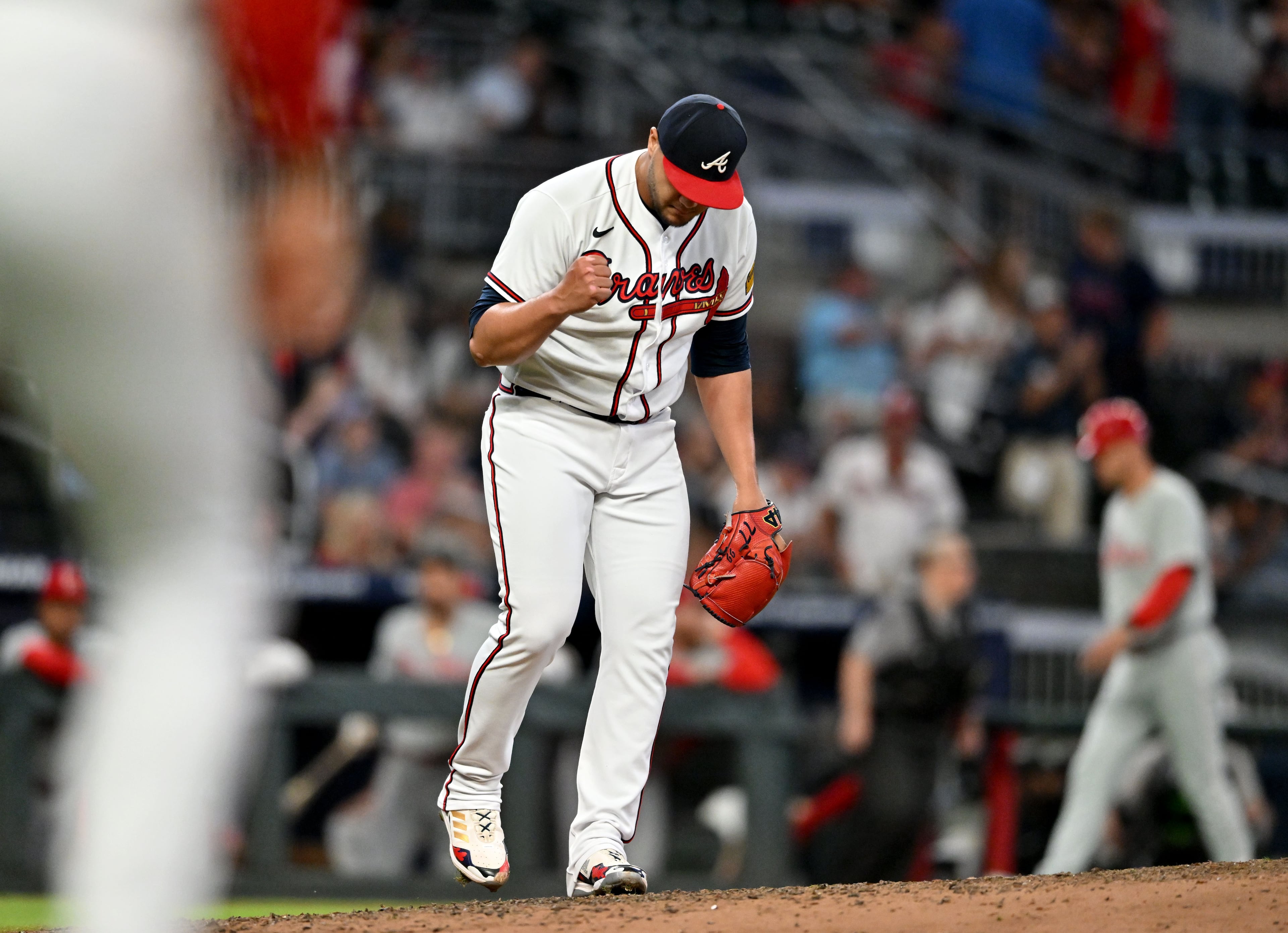 Atlanta Braves pitcher Joe Jiménez (77) reacts after Phillies first baseman Alec Bohm grounded to end the ninth inning at Truist Park. (Hyosub Shin / Hyosub.Shin@ajc.com)
