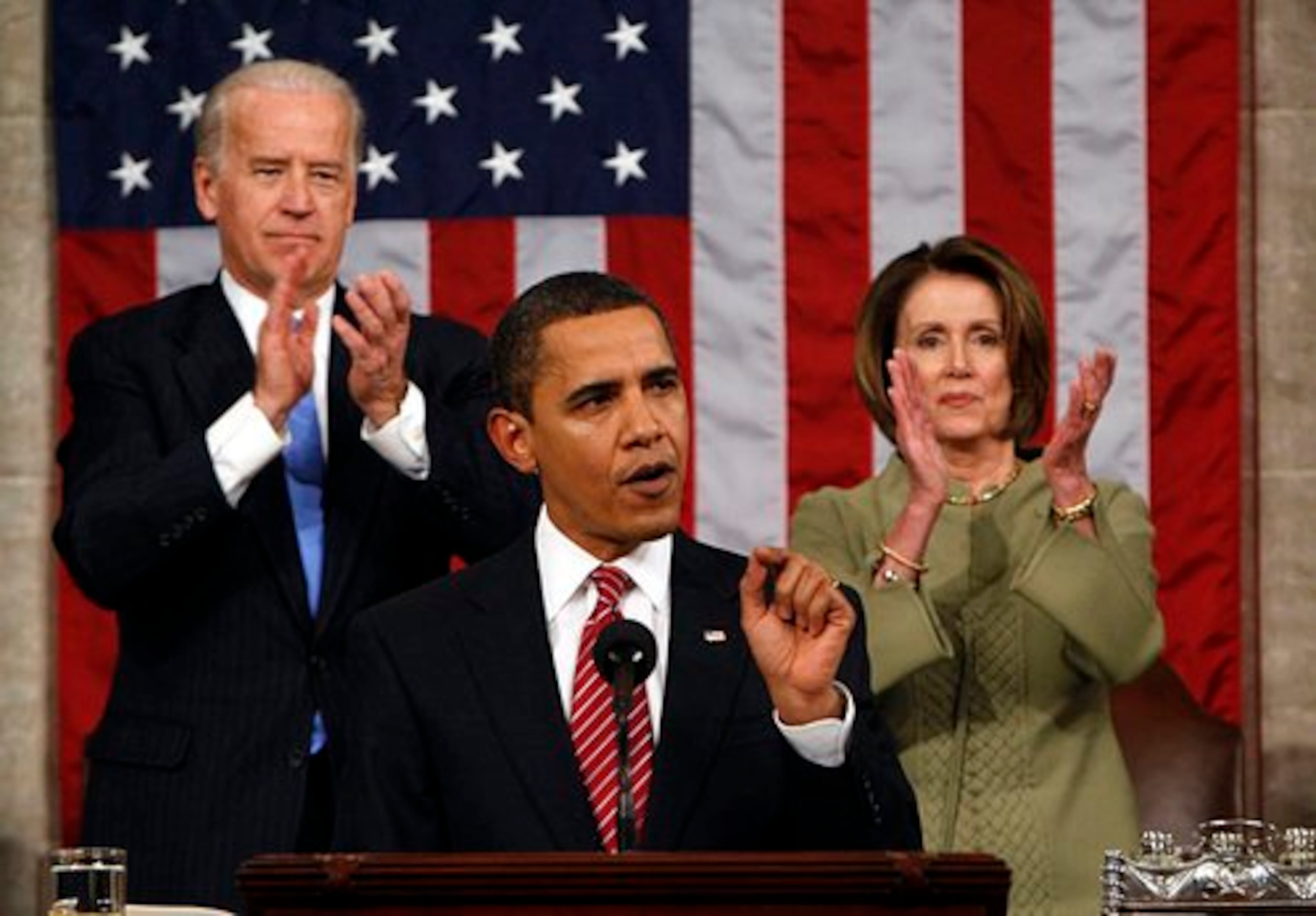 Vice President Joe Biden and House Speaker Nancy Pelosi applaud as President Obama addresses a joint session of Congress in the House Chamber of the Capitol in Washington, Tuesday, Feb. 24, 2009.