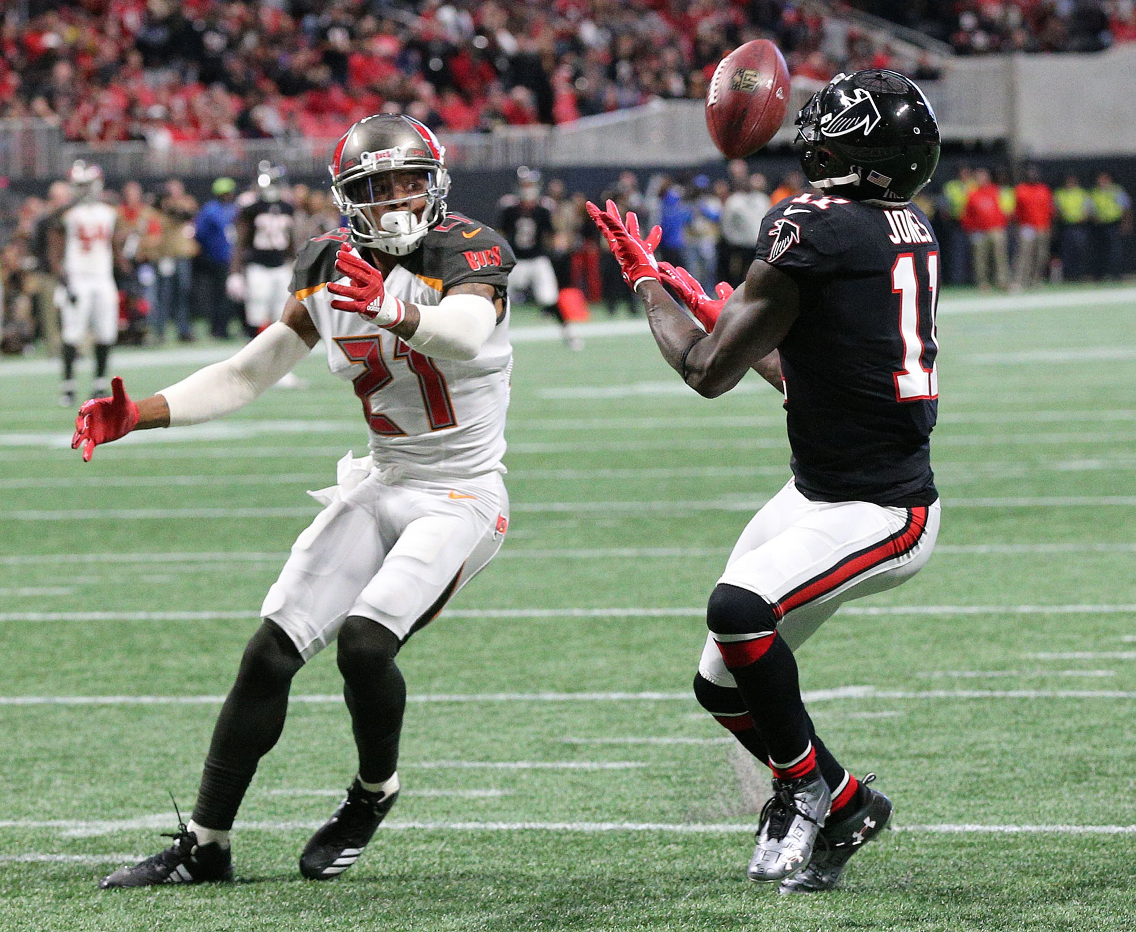 November 26, 2017 Atlanta: Falcons wide receiver Julio Jones catches a touchdown pass past Buccaneers safety Justin Evans on a pass from wide receiver Mohamed Sanu for a trick play to take a 10-3 lead during the second quarter in a NFL football game on Sunday, November 26, 2017, in Atlanta. Jones caught two touchdown passes in the second quarter. Curtis Compton/ccompton@ajc.com