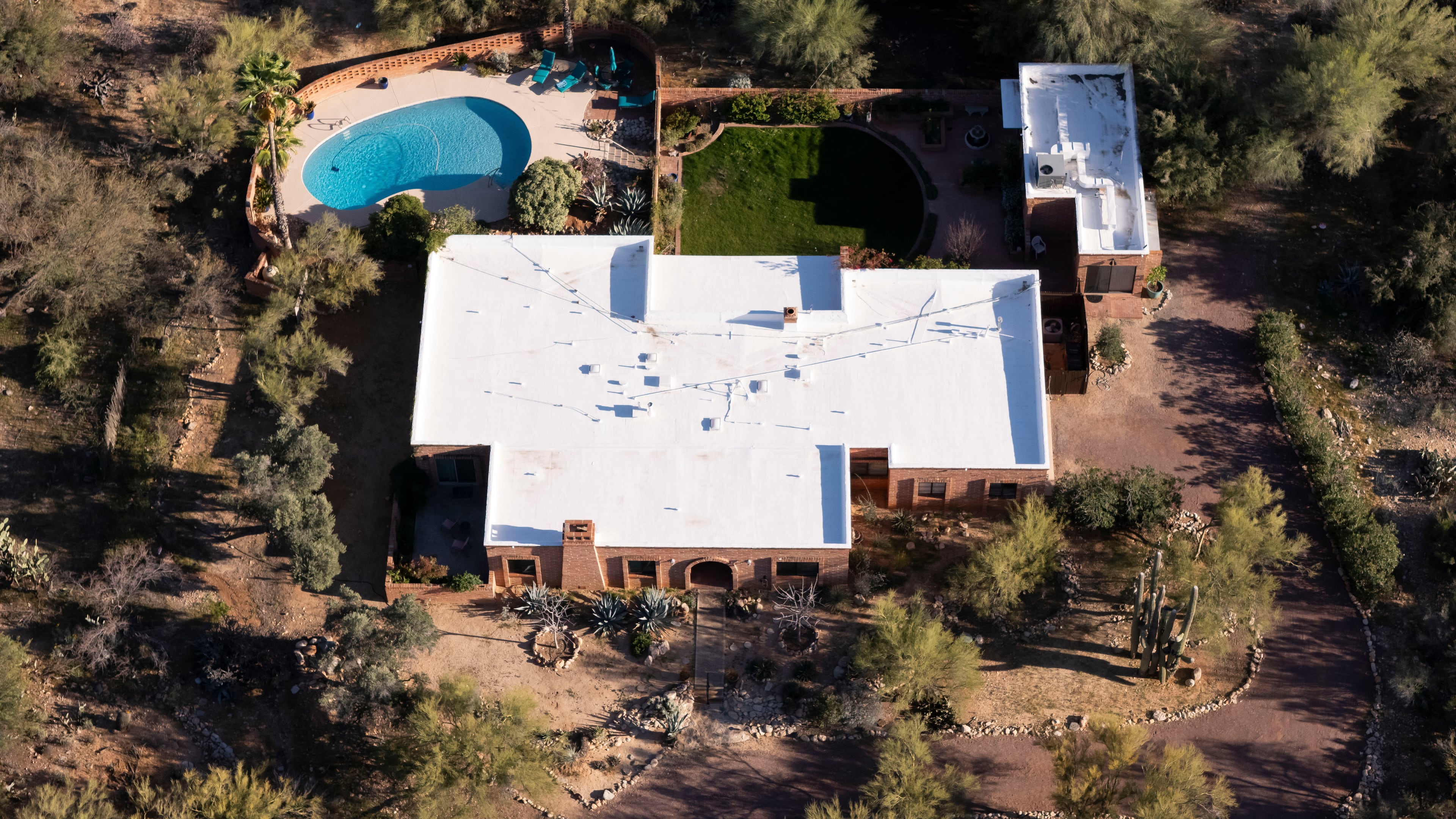 FILE - An aerial view of the home of Nancy Guthrie, the missing mother of "Today" show host Savannah Guthrie, in Tucson, Ariz., on Friday, March 6, 2026,. (AP Photo/Rebecca Noble,File)