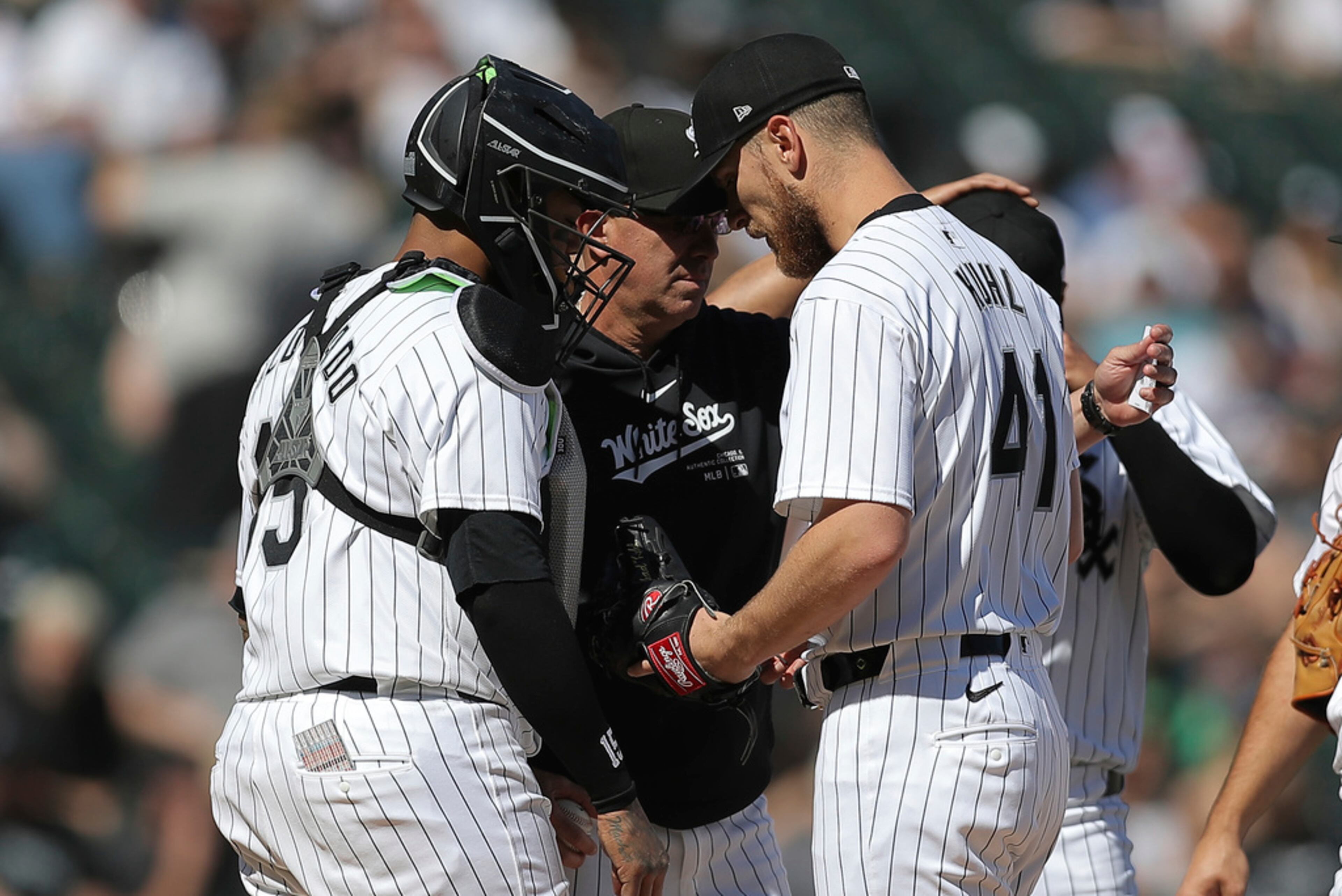 Chicago White Sox's manager Pedro Grifol, center, removes Chad Kuhl, right, during the fourth inning of a baseball game against the Atlanta Braves, Thursday, June 27, 2024, in Chicago. (AP Photo/Melissa Tamez)