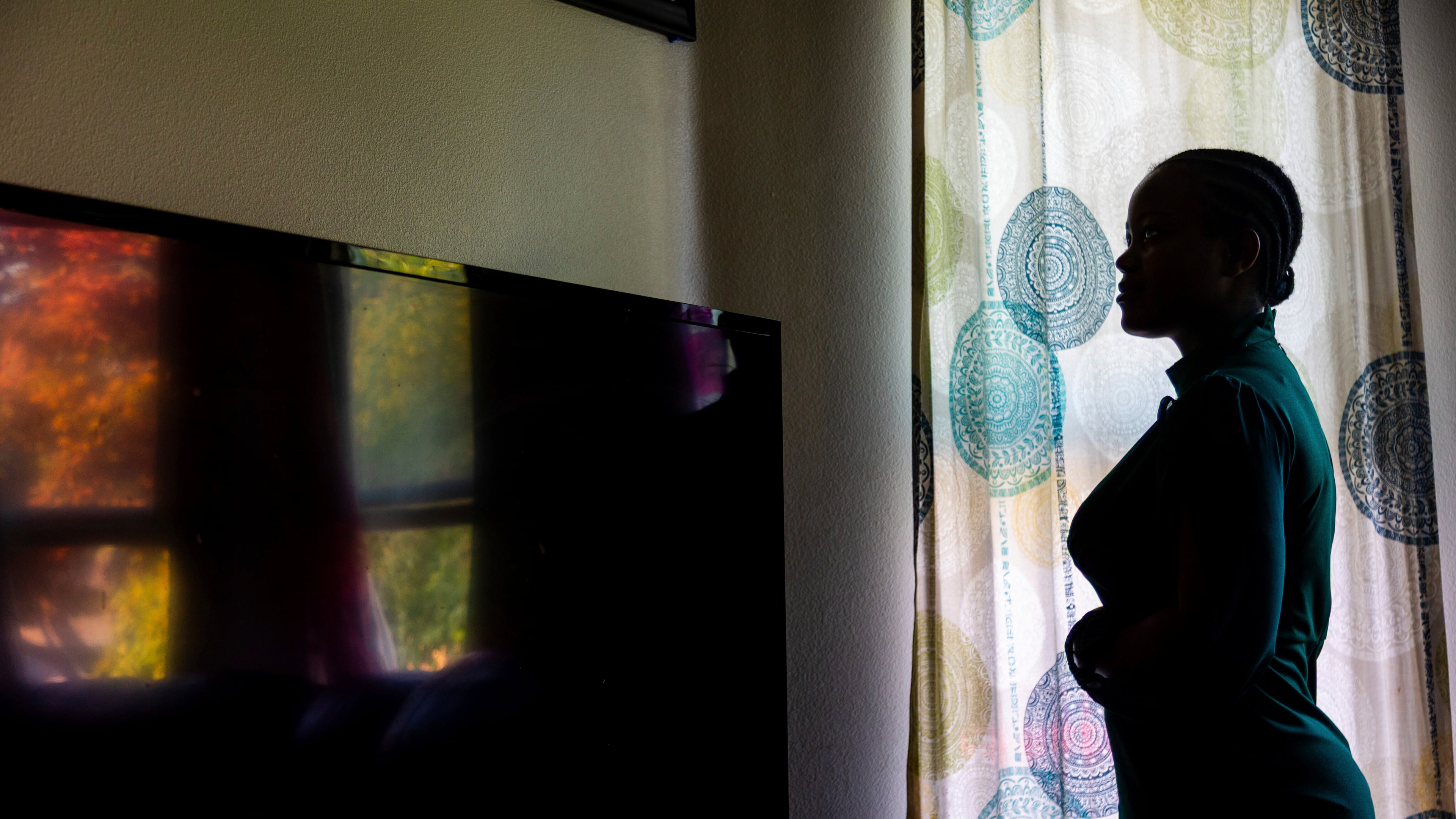 FILE - A Congolese refugee, a plaintiff in a federal lawsuit over the Trump administration's move to shut down the "join-to-follow" refugee program, poses at her home in Boise, Idaho, June 23, 2025. (AP Photo/Kyle Green, file)