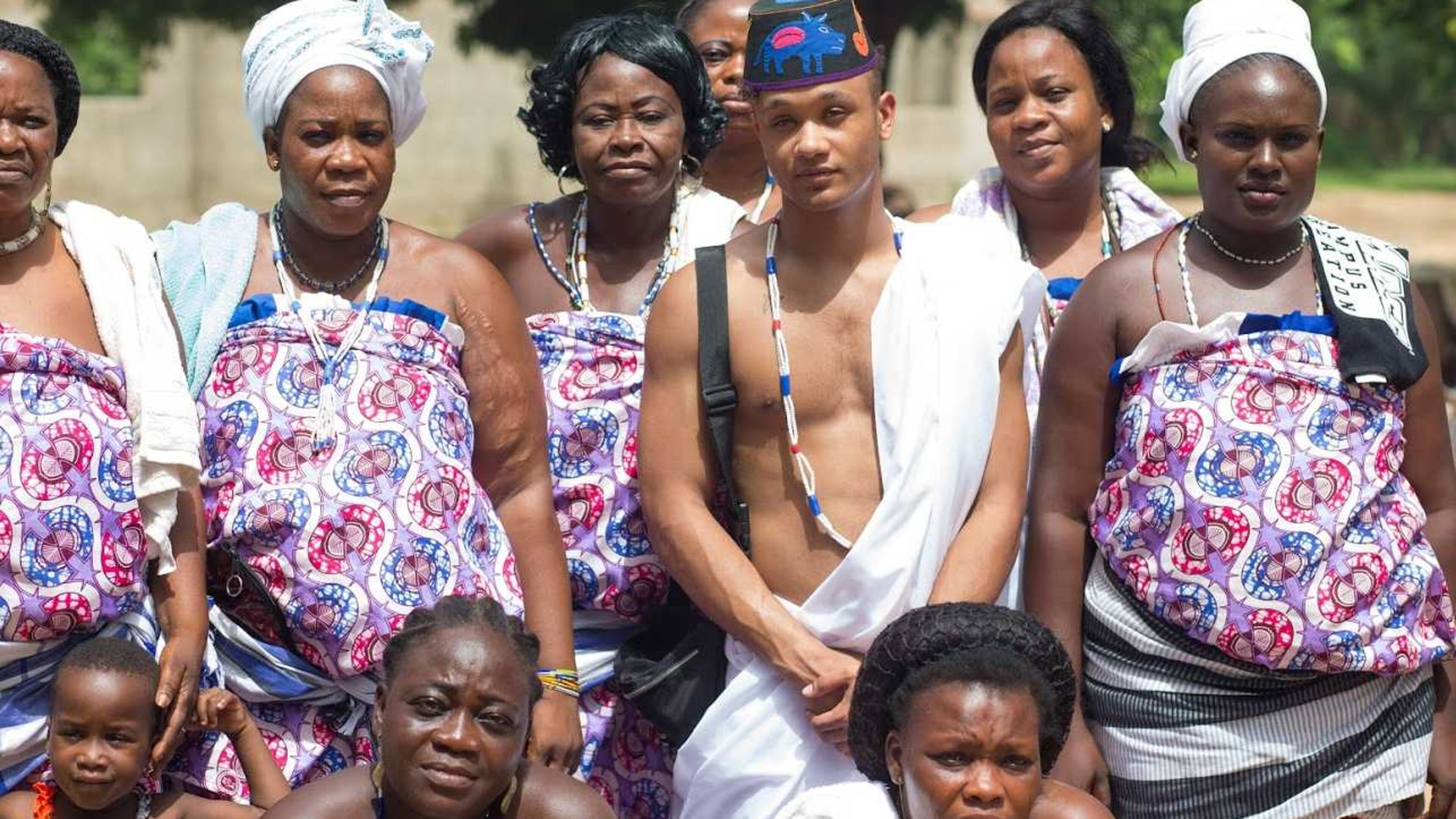 Kieron Christian Graham stands with villagers from Benin, the African country from where his ancestors hail.