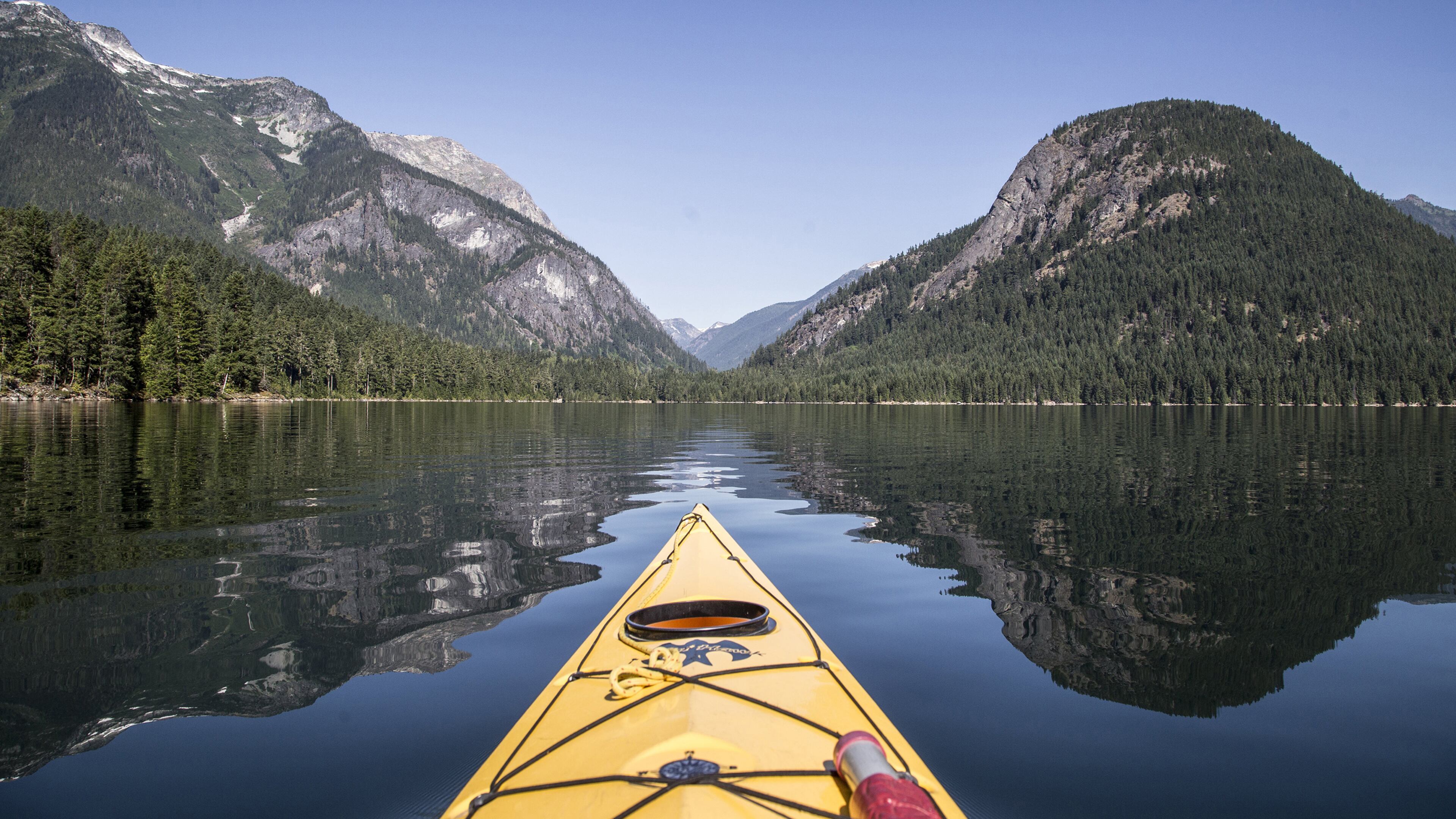 Paddling on Ross Lake, with Pumpkin Mountain at right. In the saddle is the Big Beaver Creek trail in North Cascades National Park. (Steve Ringman/Seattle Times/TNS)