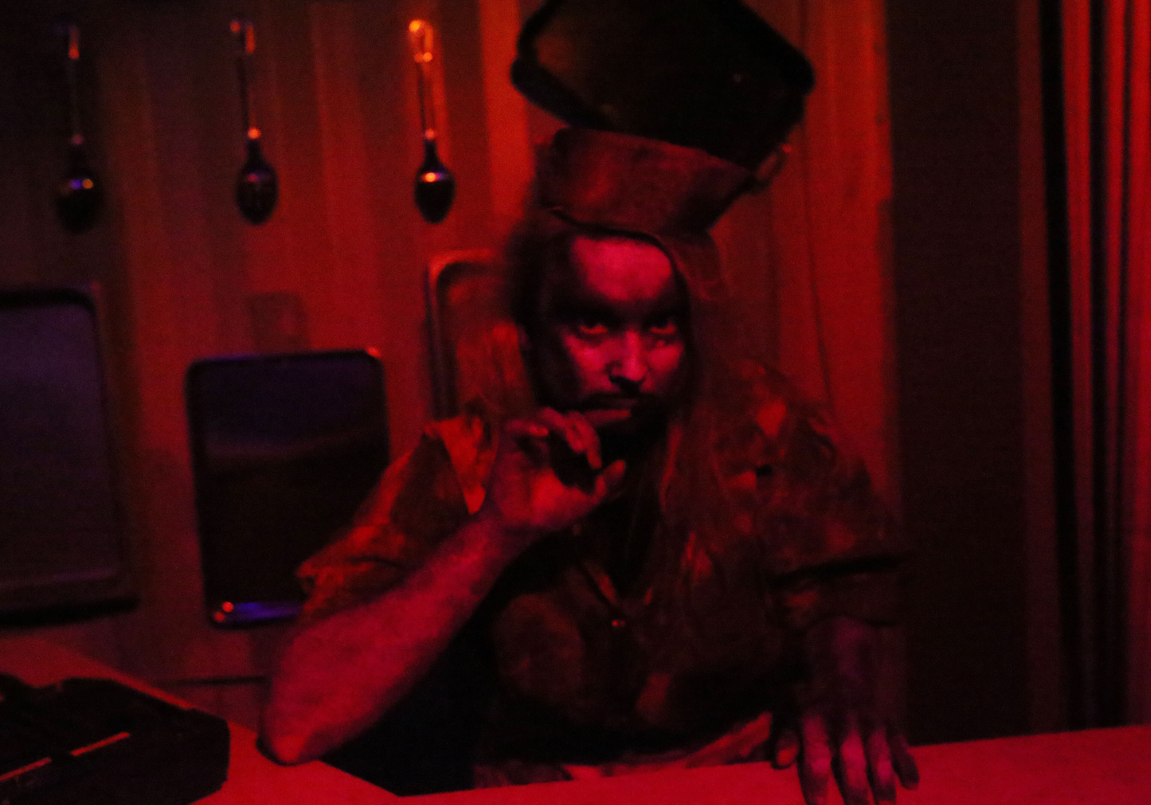 OCTOBER 2, 2013-ATLANTA:Courtney Brannon is bathed in red light in the kitchen from hell as she prepares for the opening of "Containment," Atlanta's newest giant haunted house at Atlantic Station on Wednesday October 2nd, 2013. All employees participated in Containment Crew University to learn about the operation of Containment. The crew of 43 actors chosen from the hundreds that auditioned learned everything about how it operates, makeup, costuming, how to scare people and what to do if someone reacts badly to being scared. Containment, housed on 20 containers underneath Atlantic Station, runs from October 4th-November 3rd. PHIL SKINNER / PSKINNER@AJC.COM