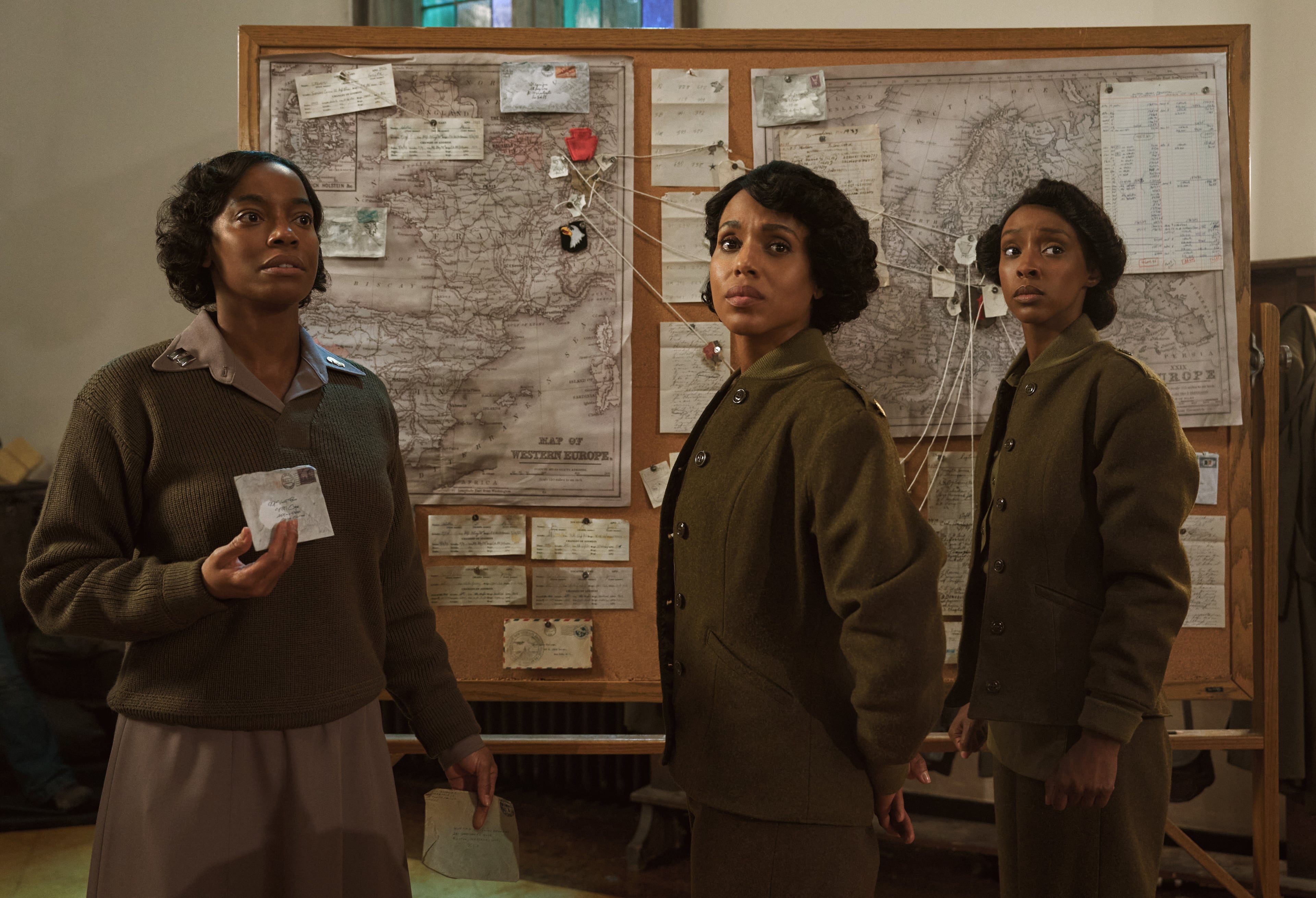 From left: actresses Milauna Jackson, Kerry Washington and Ebony Obsidian in "The Six Triple Eight."